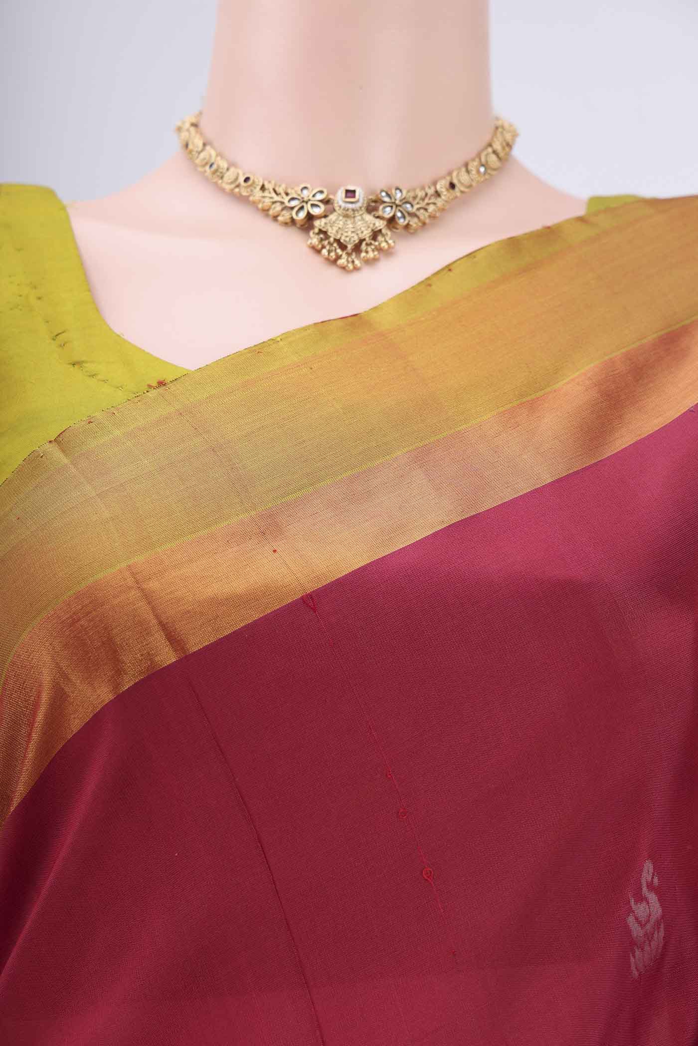 Border image of Rani Pink Uppada Silk Saree with Zari Butta on the body and Zari Border. 