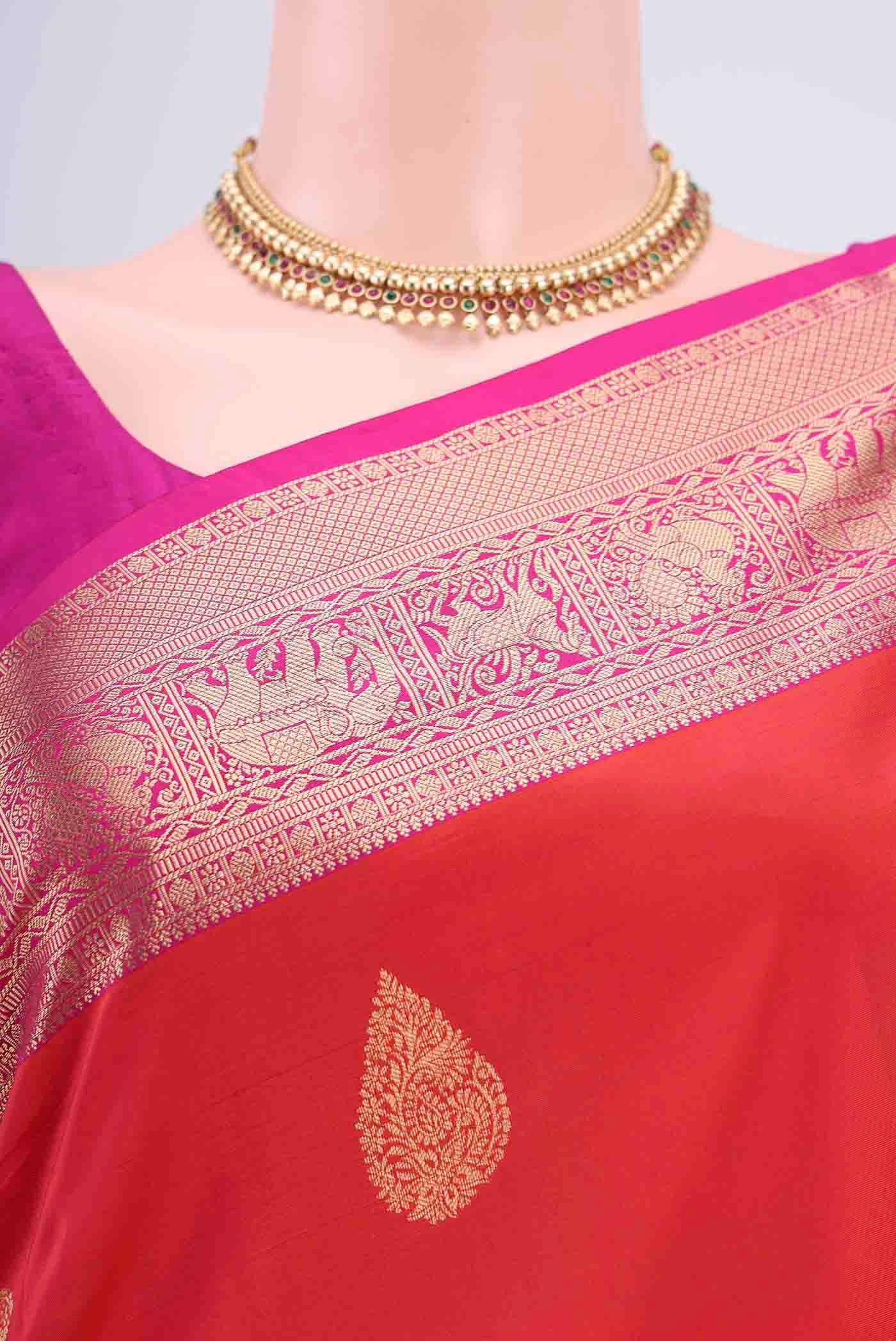 Border image of Orange with Pink Color Soft Silk Saree with Zari Butta on the body and Zari Border
