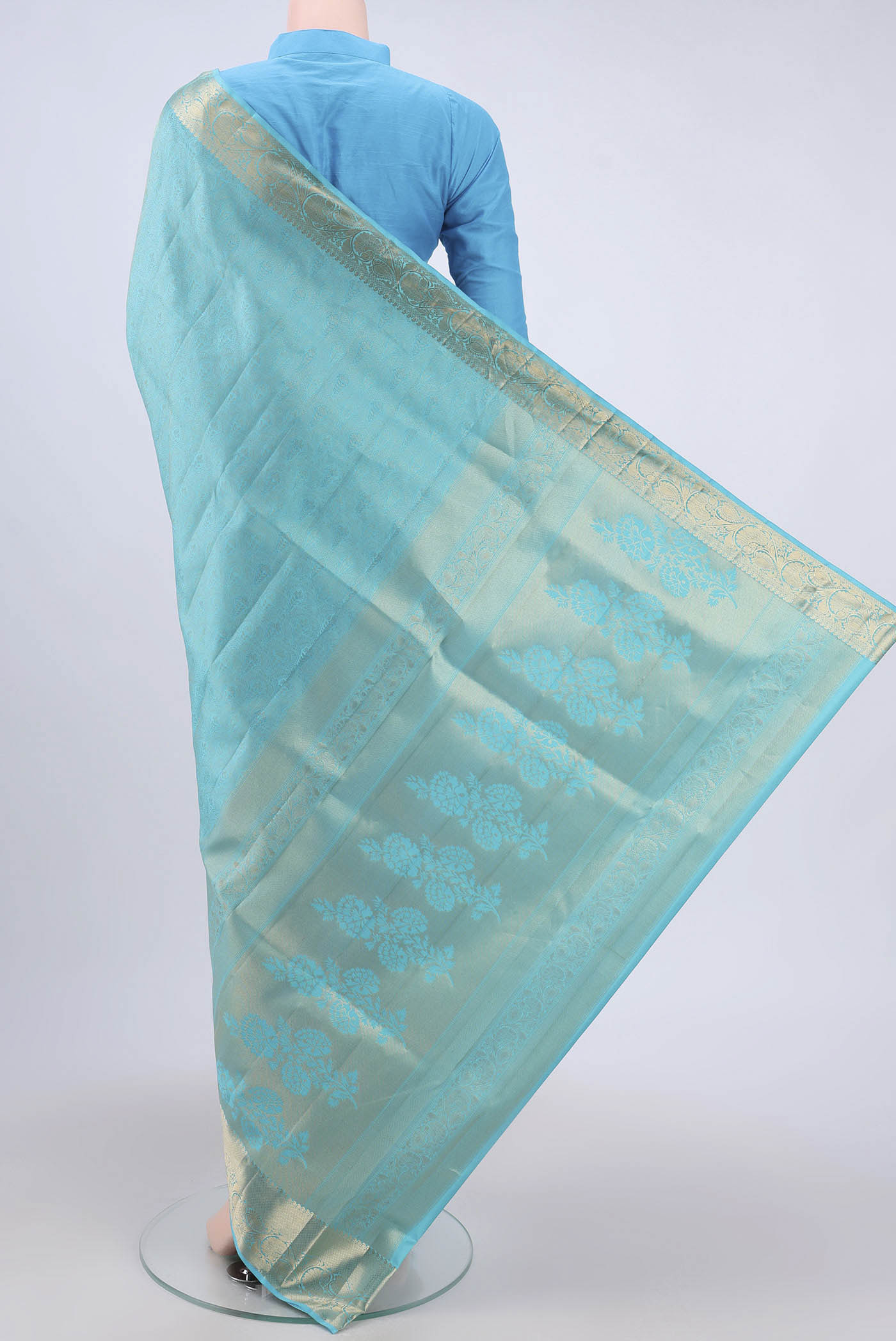 Flat view of Turquoise Soft Silk Saree with Zari Brocade on the body and Zari Border. 