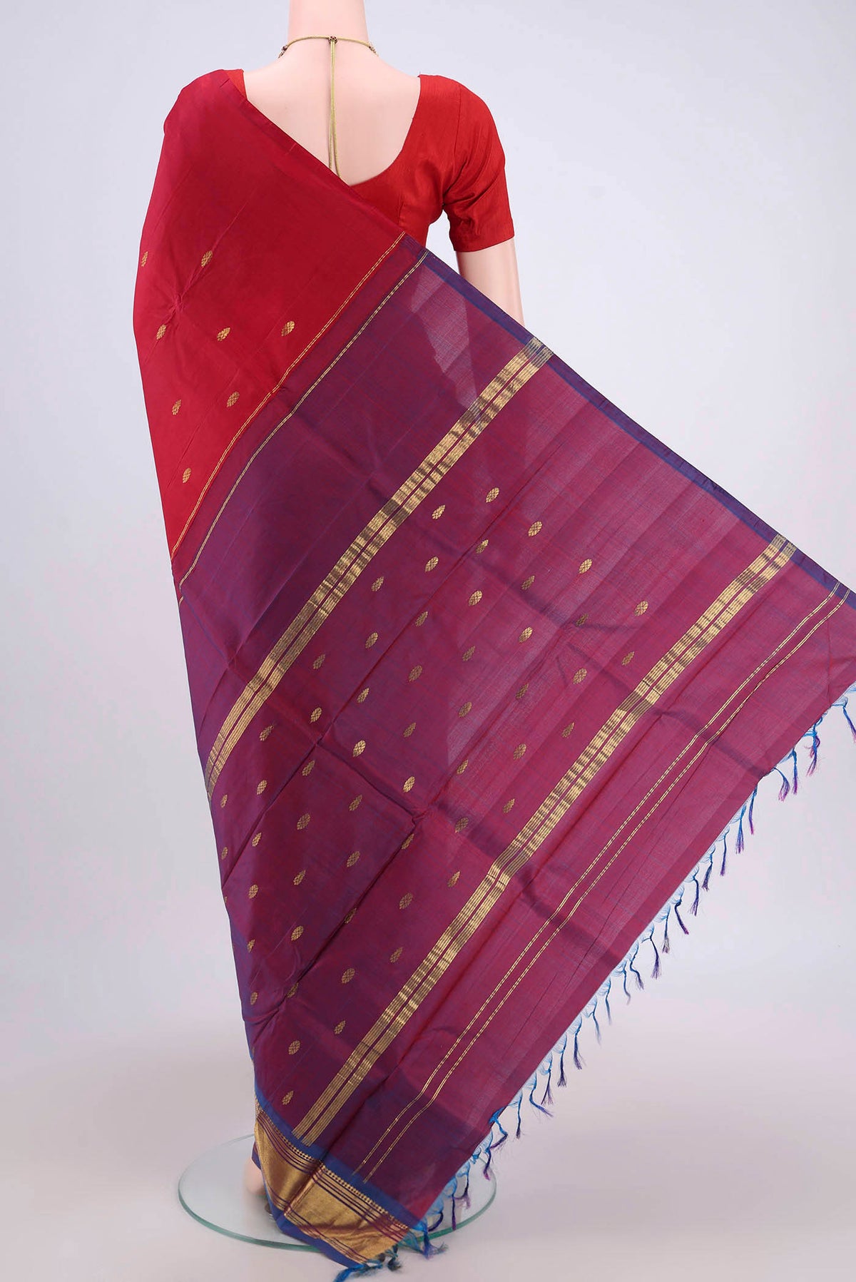 Flat view of Maroon Kanjivaram Silk Saree with Zari Butta on the body and One Side Border. 