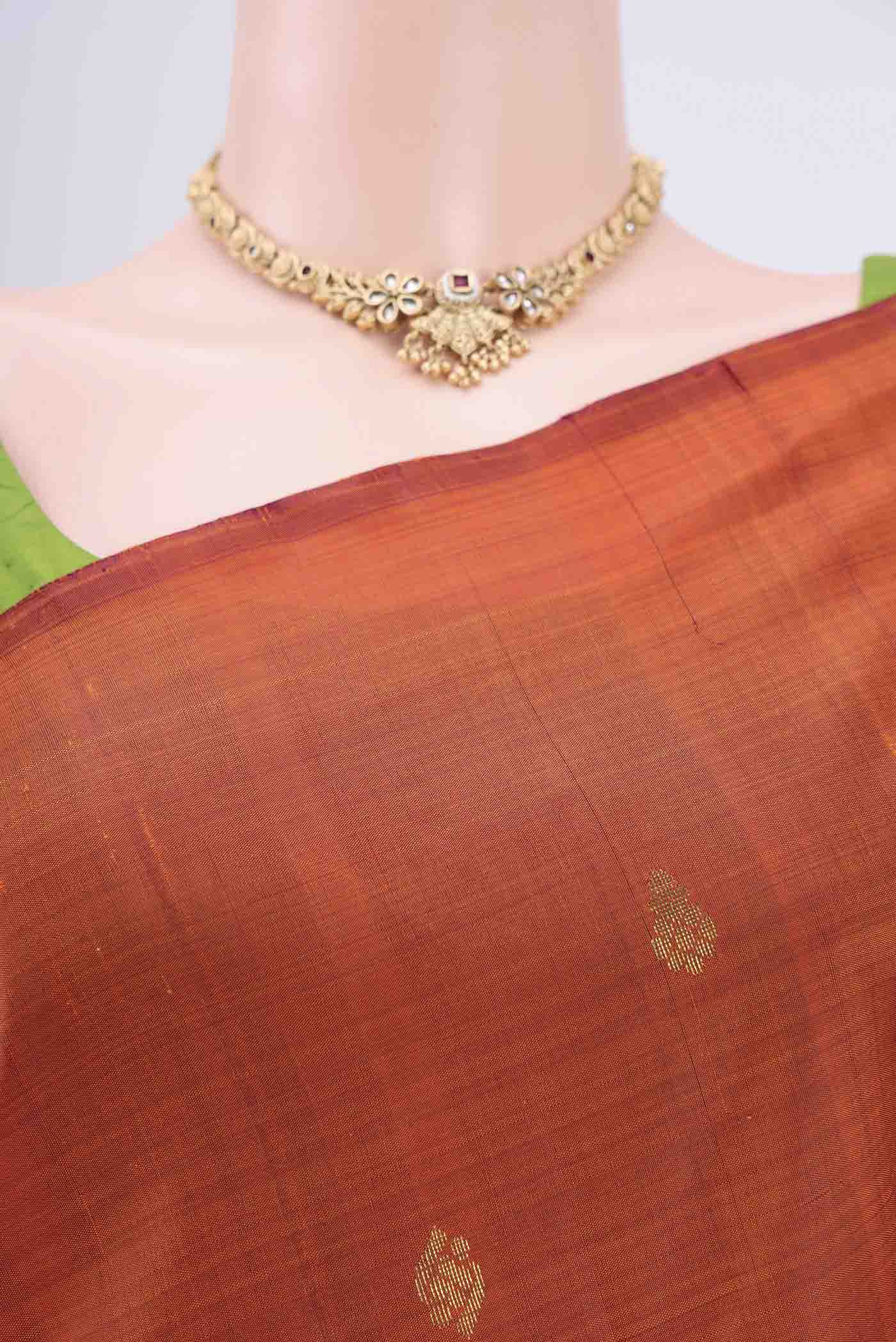 Border image of Rust Kanjivaram Silk Saree with Zari Butta on the body and One Side Border. 