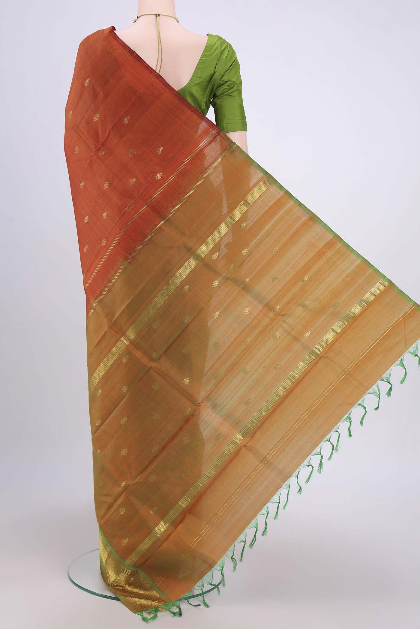 Flat view of Rust Kanjivaram Silk Saree with Zari Butta on the body and One Side Border. 