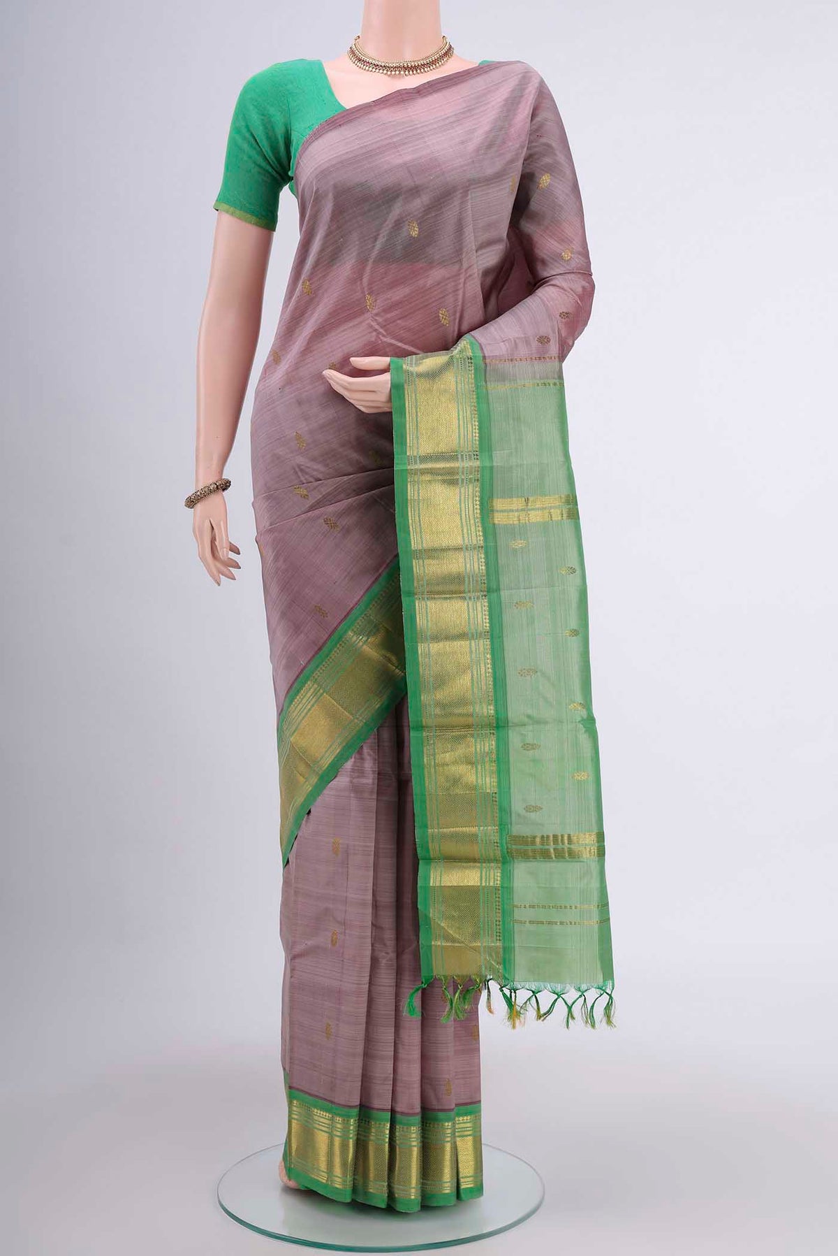 Mauve Kanchipuram Silk Saree with Zari Butta on the body and One Side Border displayed on a mannequin