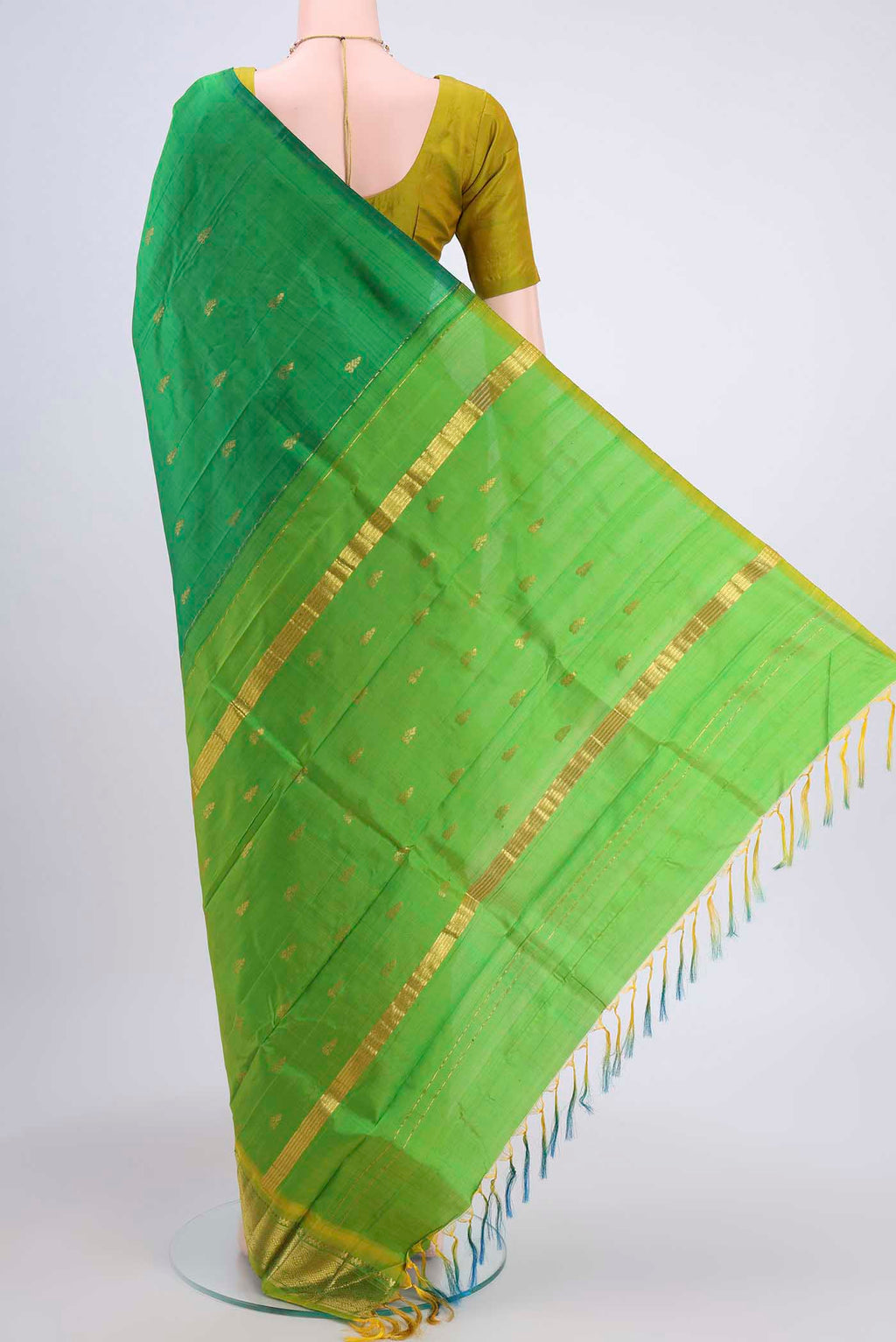 Flat view of Green Kanchipuram Silk Saree with Zari Butta on the body and One Side Border