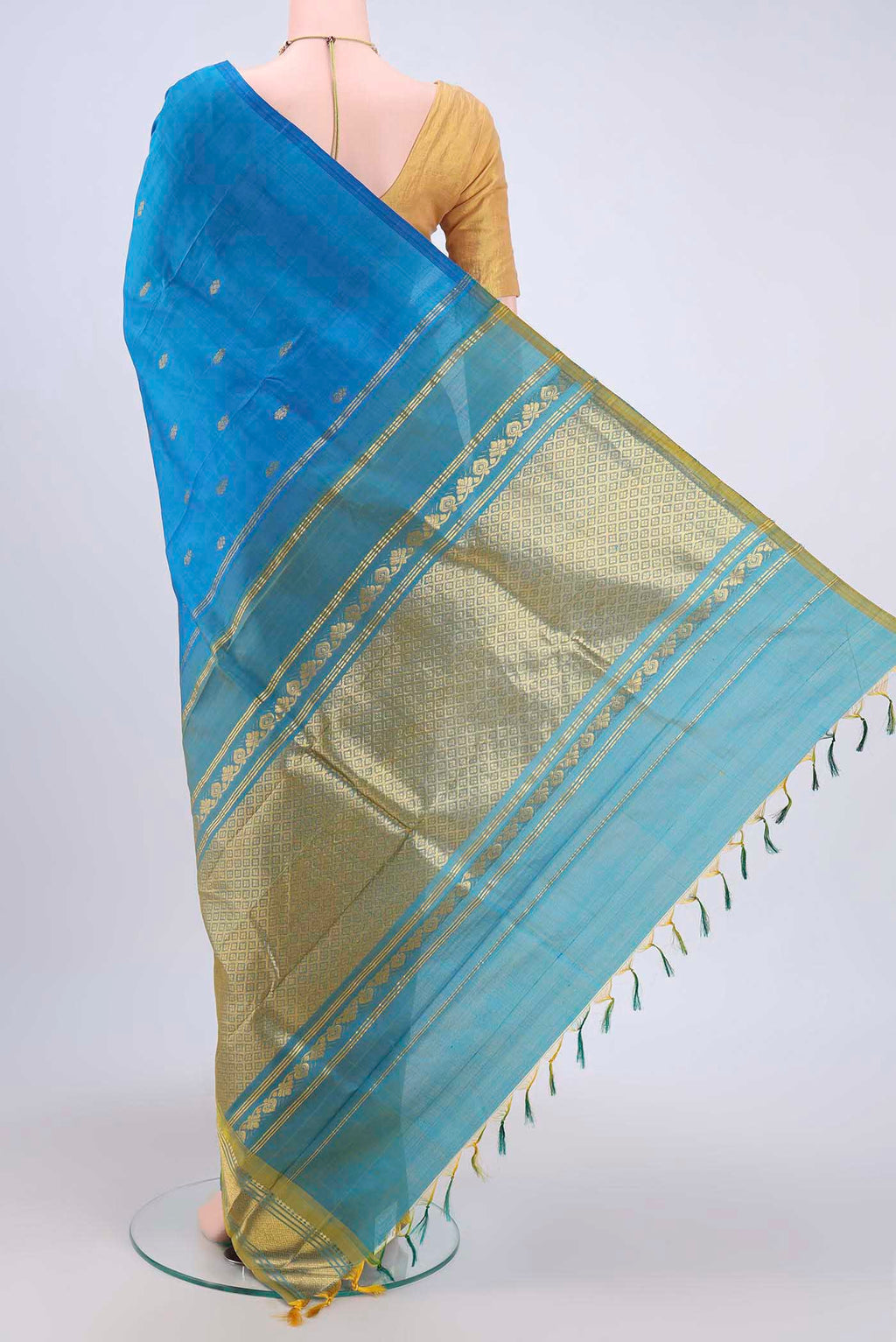 Flat view of Blue Kanjivaram Silk Saree with Zari Butta on the body and One Side Border. 