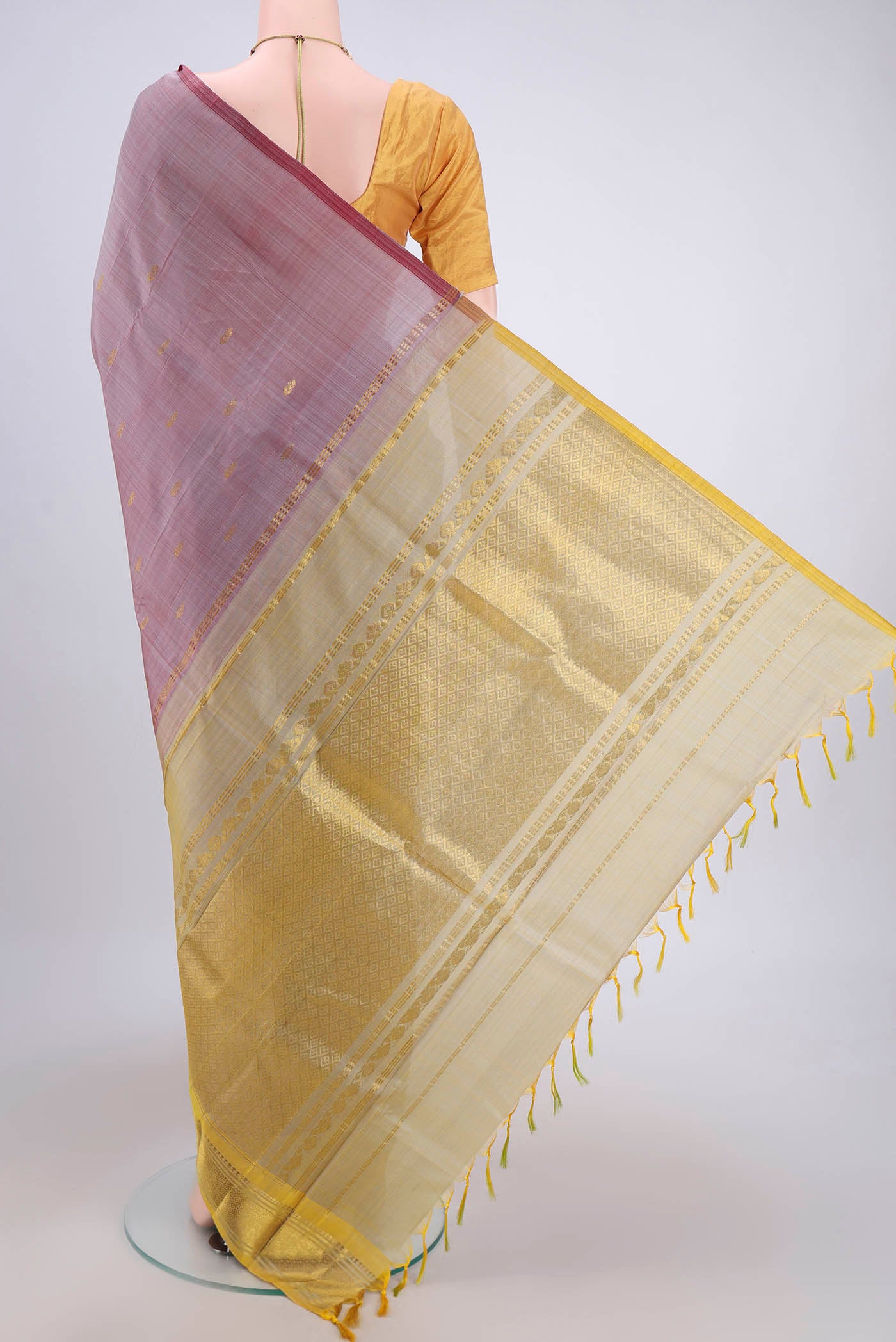 Flat view of Coral Kanjivaram Silk Saree with Zari Butta on the body and One Side Border. 