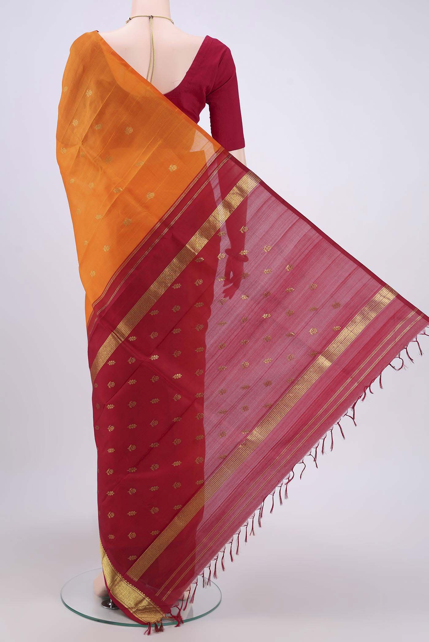Flat view of Orange Kanjivaram Silk Saree with Zari Butta on the body and One Side Border. 