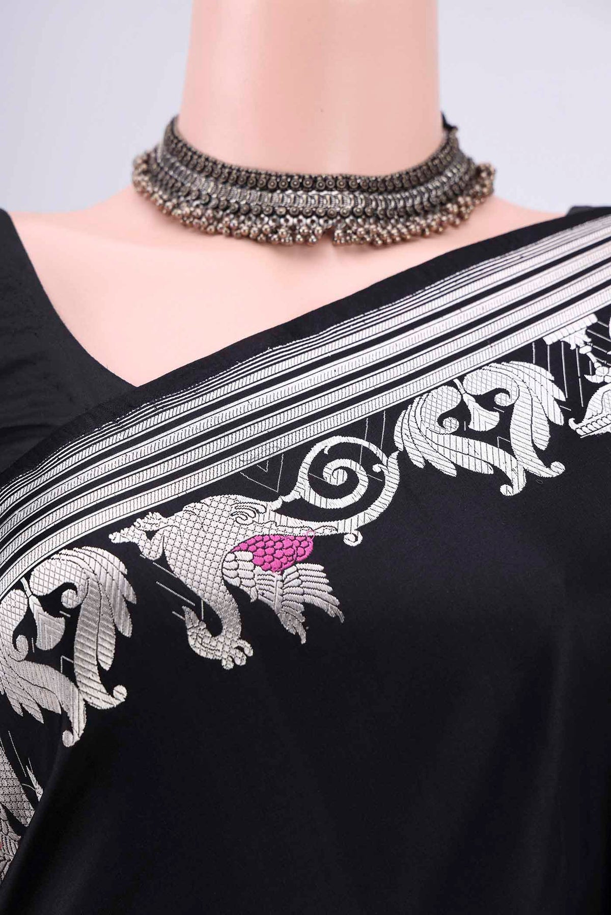 Border image of Black Assam Silk Saree with Zari Butta on the body and Zari Border. 