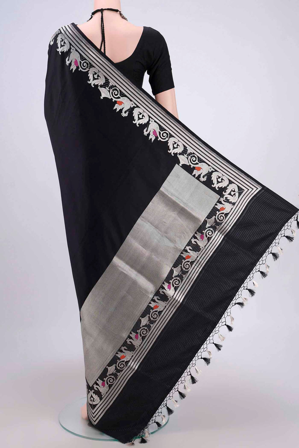 Flat view of Black Assam Silk Saree with Zari Butta on the body and Zari Border. 