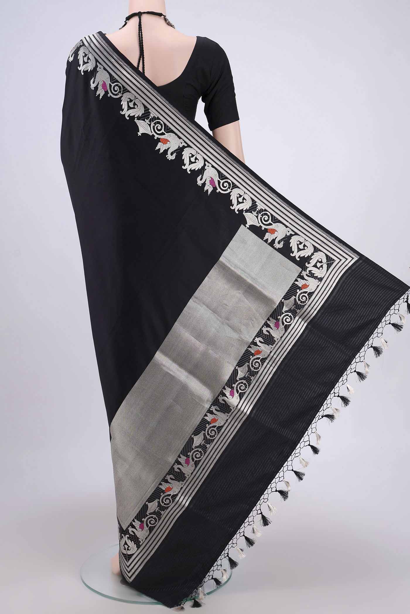 Flat view of Black Assam Silk Saree with Zari Butta on the body and Zari Border. 