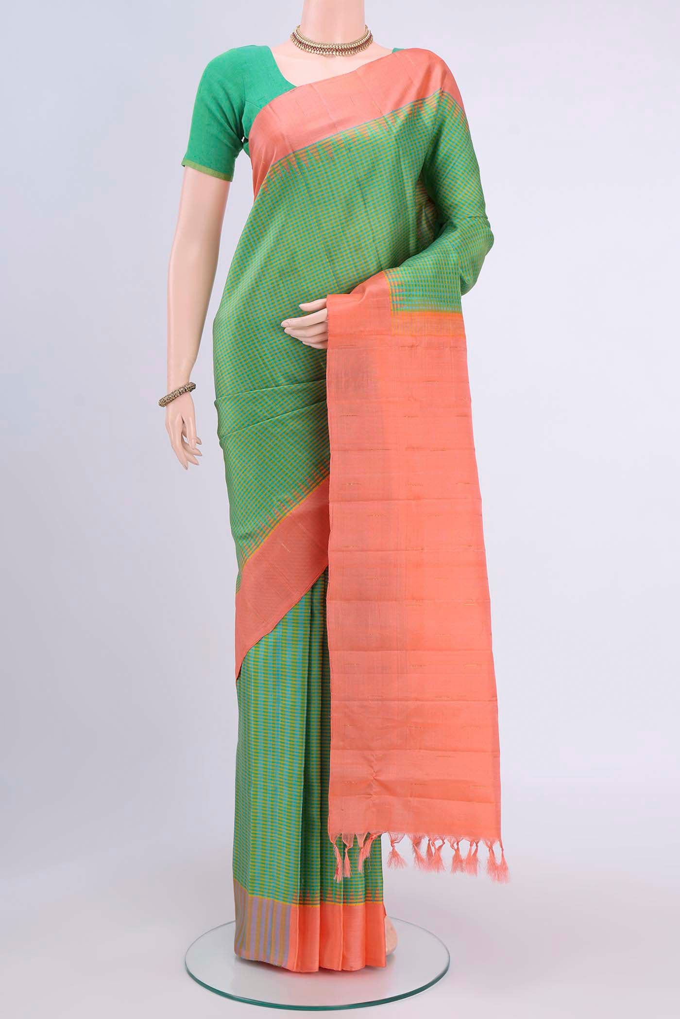 Green Gadwal Silk Saree with Checked design on the body and Plain Border displayed on a mannequin