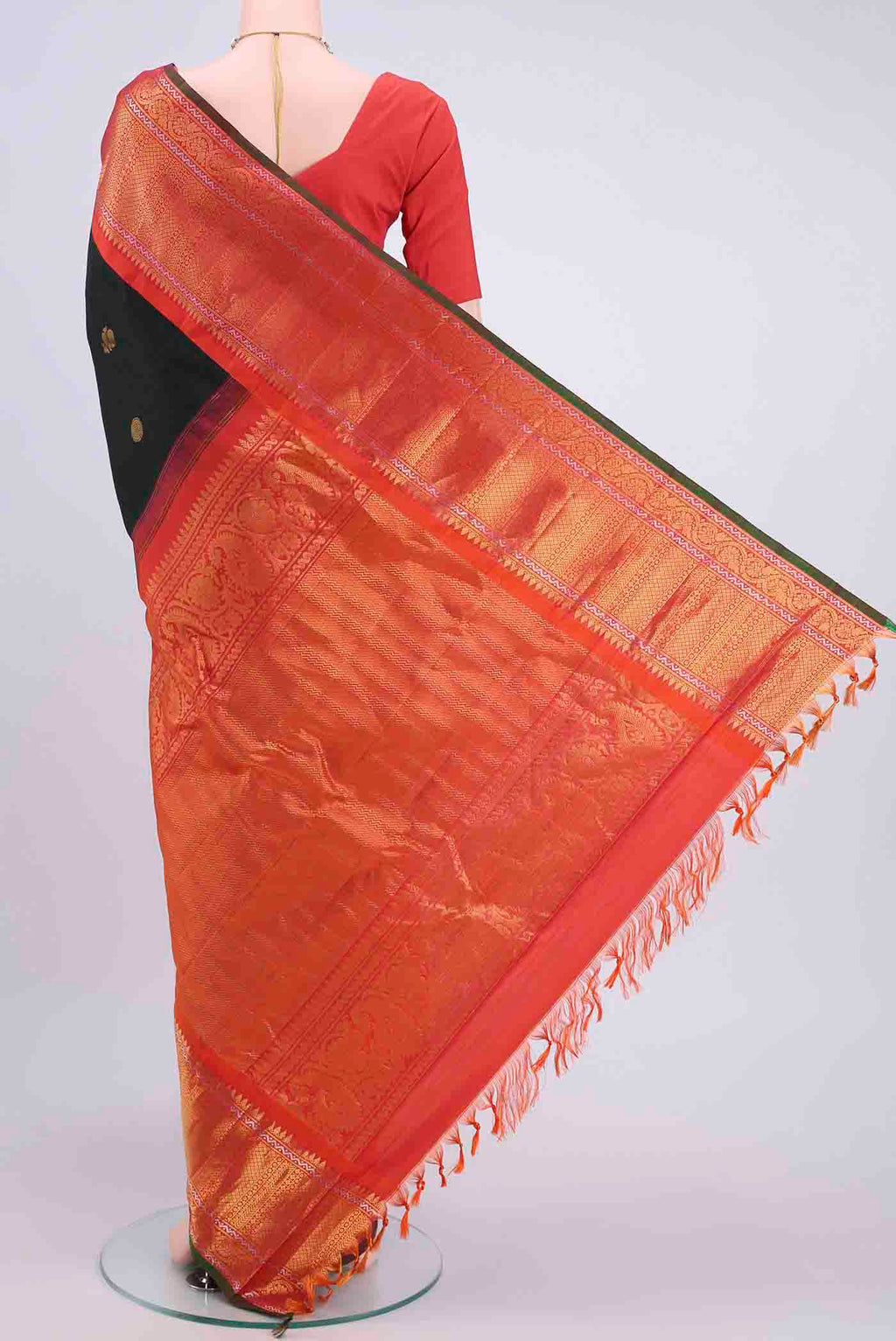 Flat view of Black Gadwal Silk Saree with Zari Butta on the body and Zari Border