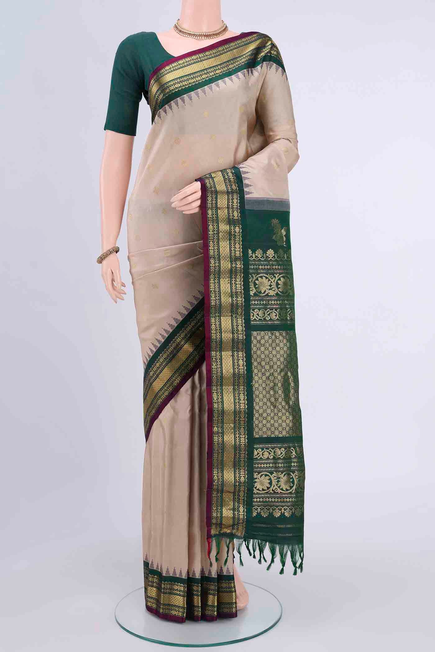 Beige Dual Tone Gadwal Silk Saree with Zari Butta on the body and Zari Border displayed on a mannequin
