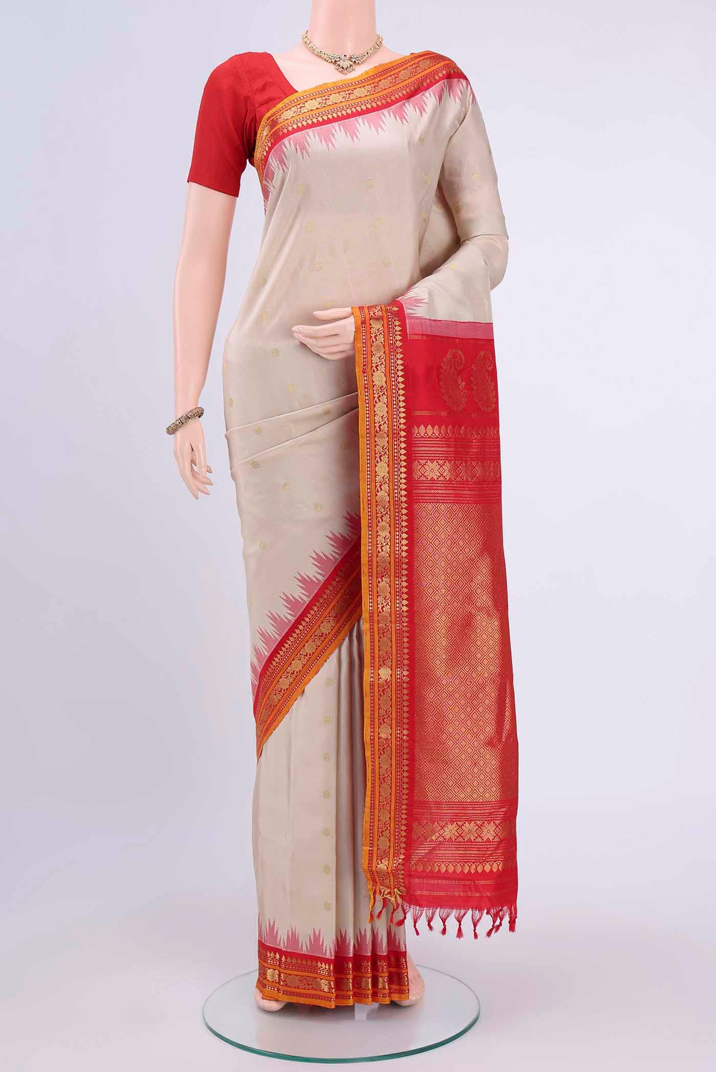 Off White Dual Tone Gadwal Silk Saree with Zari Butta on the body and Zari Border displayed on a mannequin