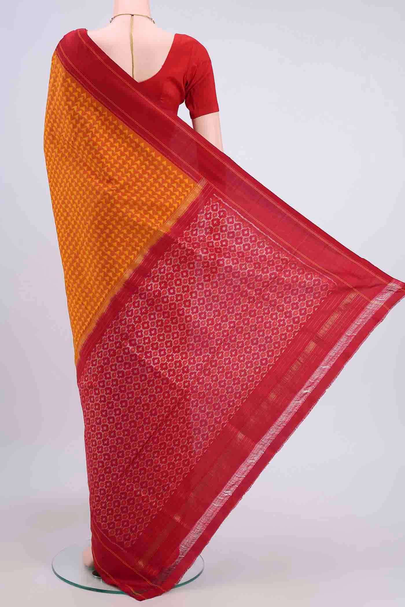 Flat view of Orange Pochampally Silk Saree with Pure Ikat on the body and Plain Border