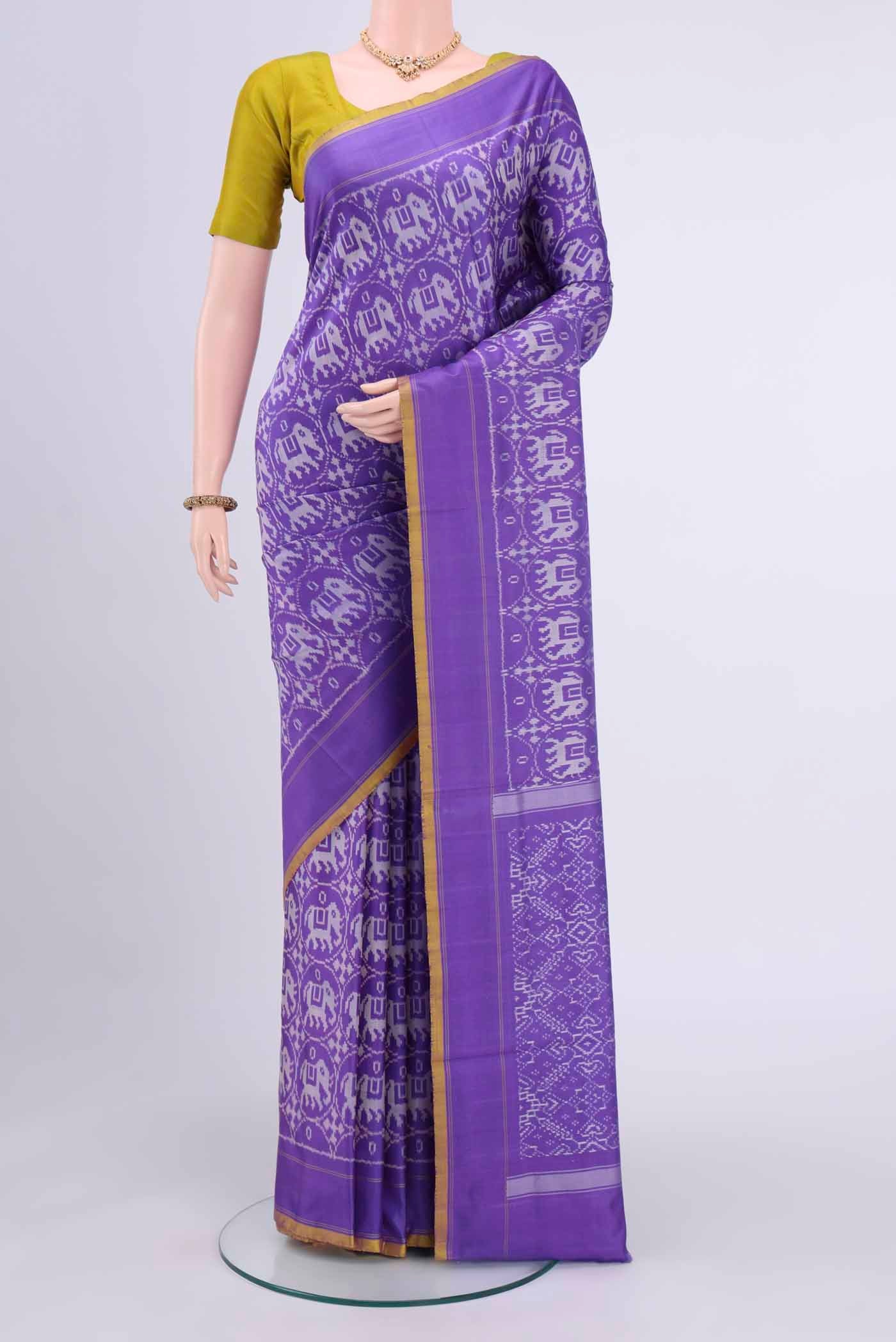 Purple Pochampally Saree with Ikat Print on the body and Ikat Border displayed on a mannequin