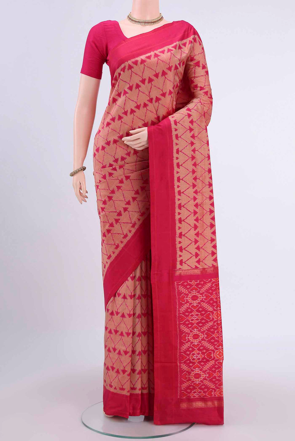 Pinkish Yellow Dual Tone Pochampally Saree with Ikat design on the body and Plain Border displayed on a mannequin