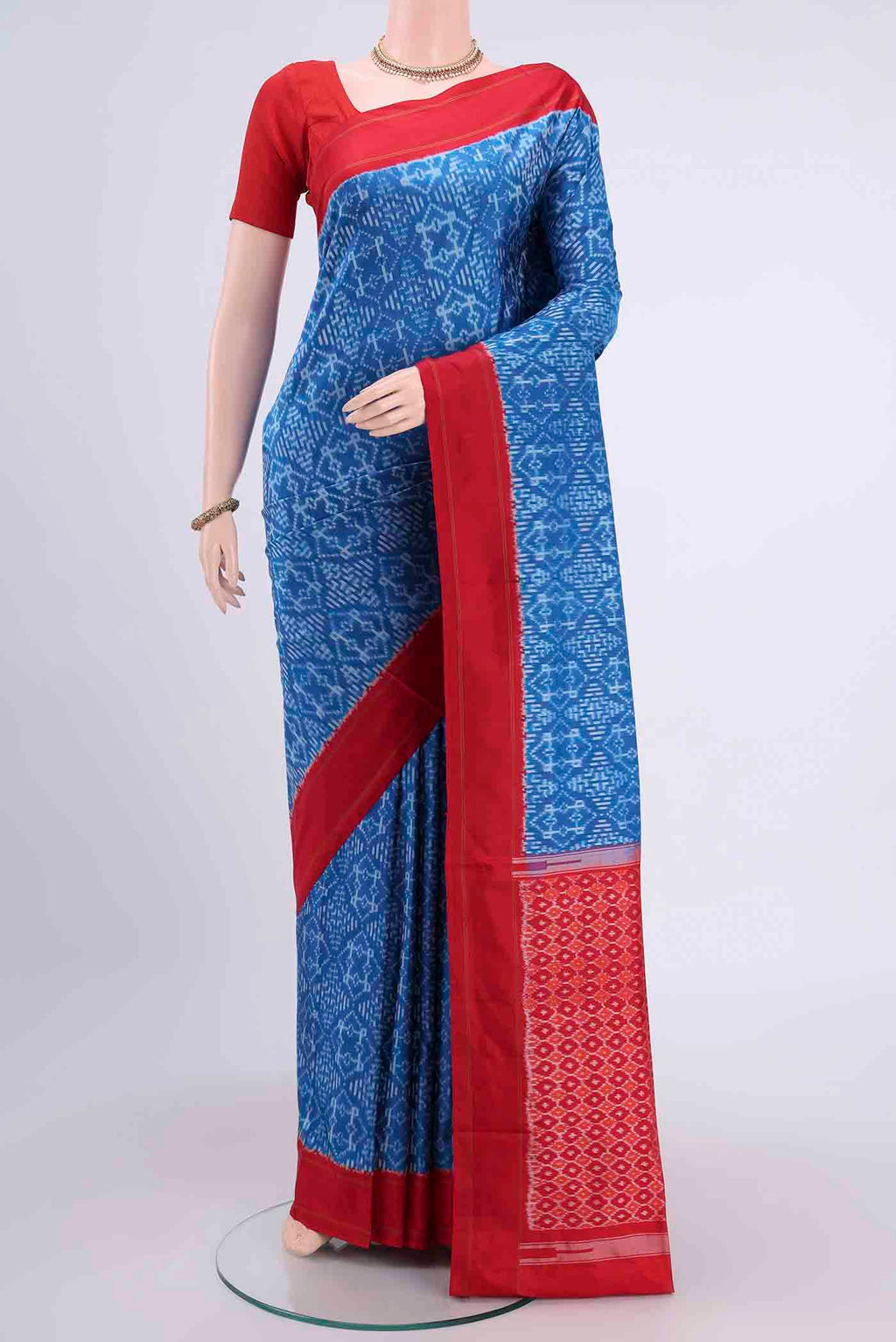 Blue Pochampally Silk Saree with Pure Ikat on the body and Plain Border displayed on a mannequin