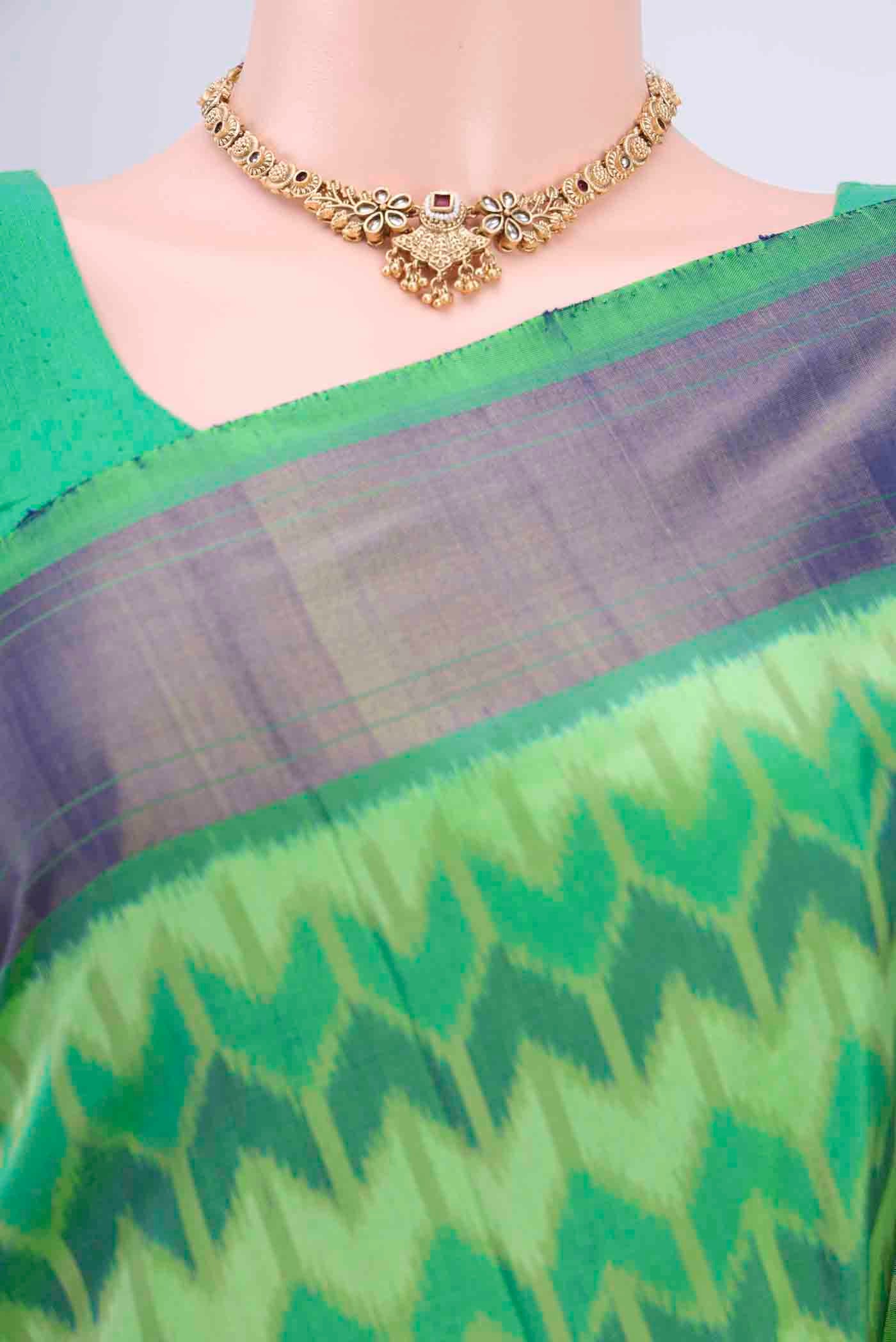 Border image of Mint Green Pochampally Saree with Ikat Print on the body and Ikat Border