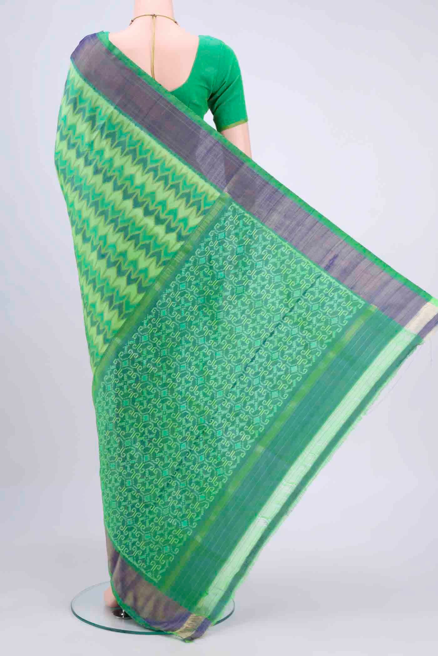 Flat view of Mint Green Pochampally Saree with Ikat Print on the body and Ikat Border