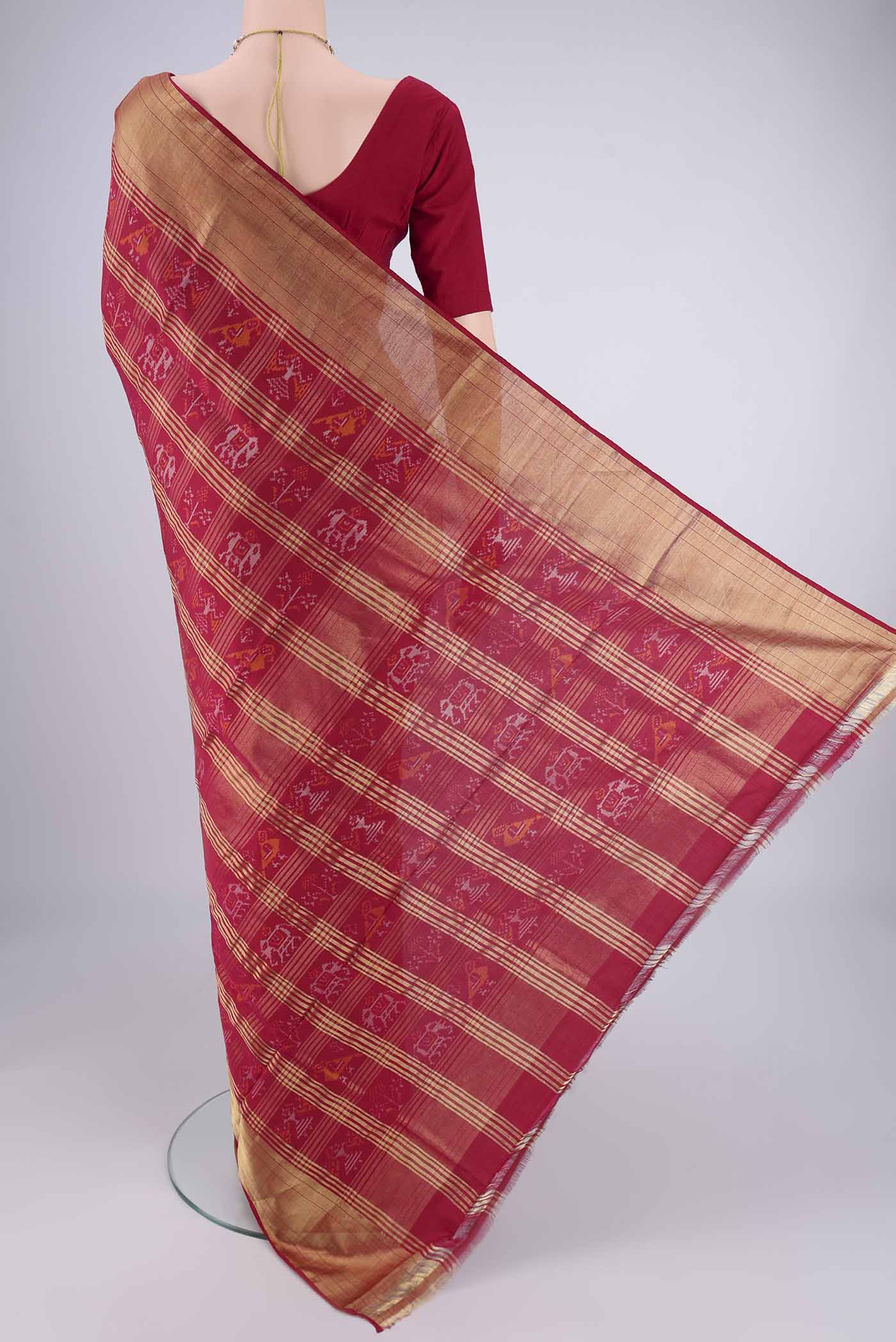 Flat view of Maroon Pochampally Silk Saree with Pure Ikat on the body and Zari Border. 