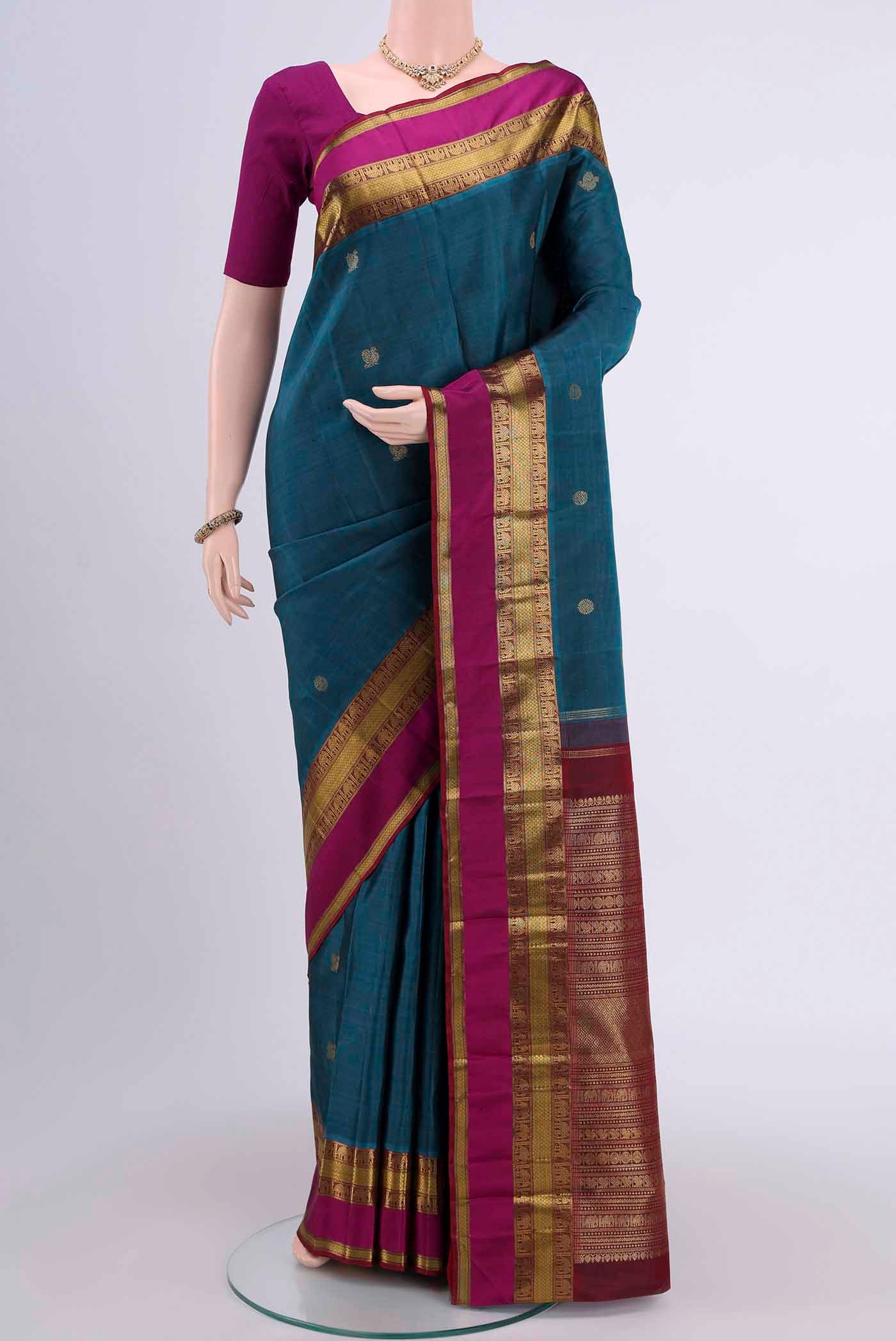 Pure Silk Pure Zari Dark Blue Kanchipuram Saree with Zari Butta on the body and Zari Border displayed on a mannequin
