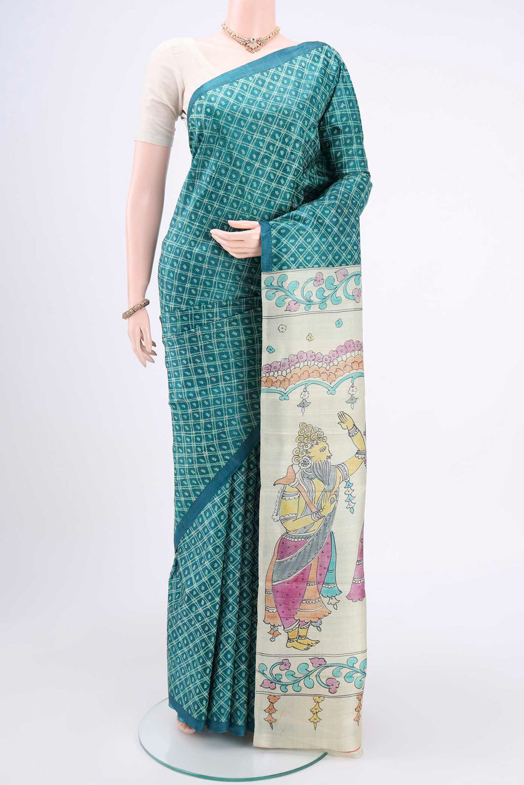 Sea Green Printed Silk Saree with Floral Print on the body and Without Border.  displayed on a mannequin