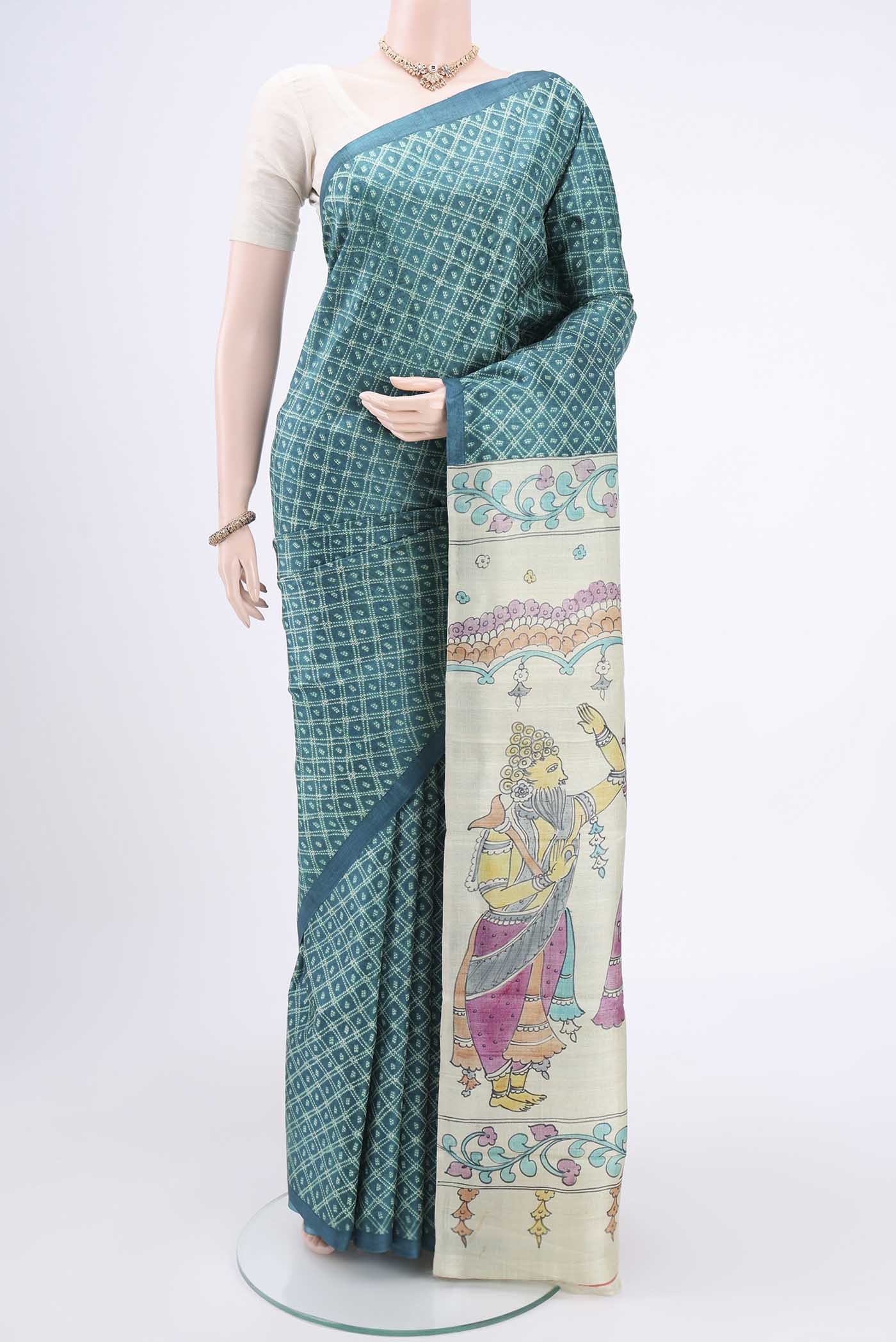 Sea Green Printed Silk Saree with Floral Print on the body and Without Border.  displayed on a mannequin
