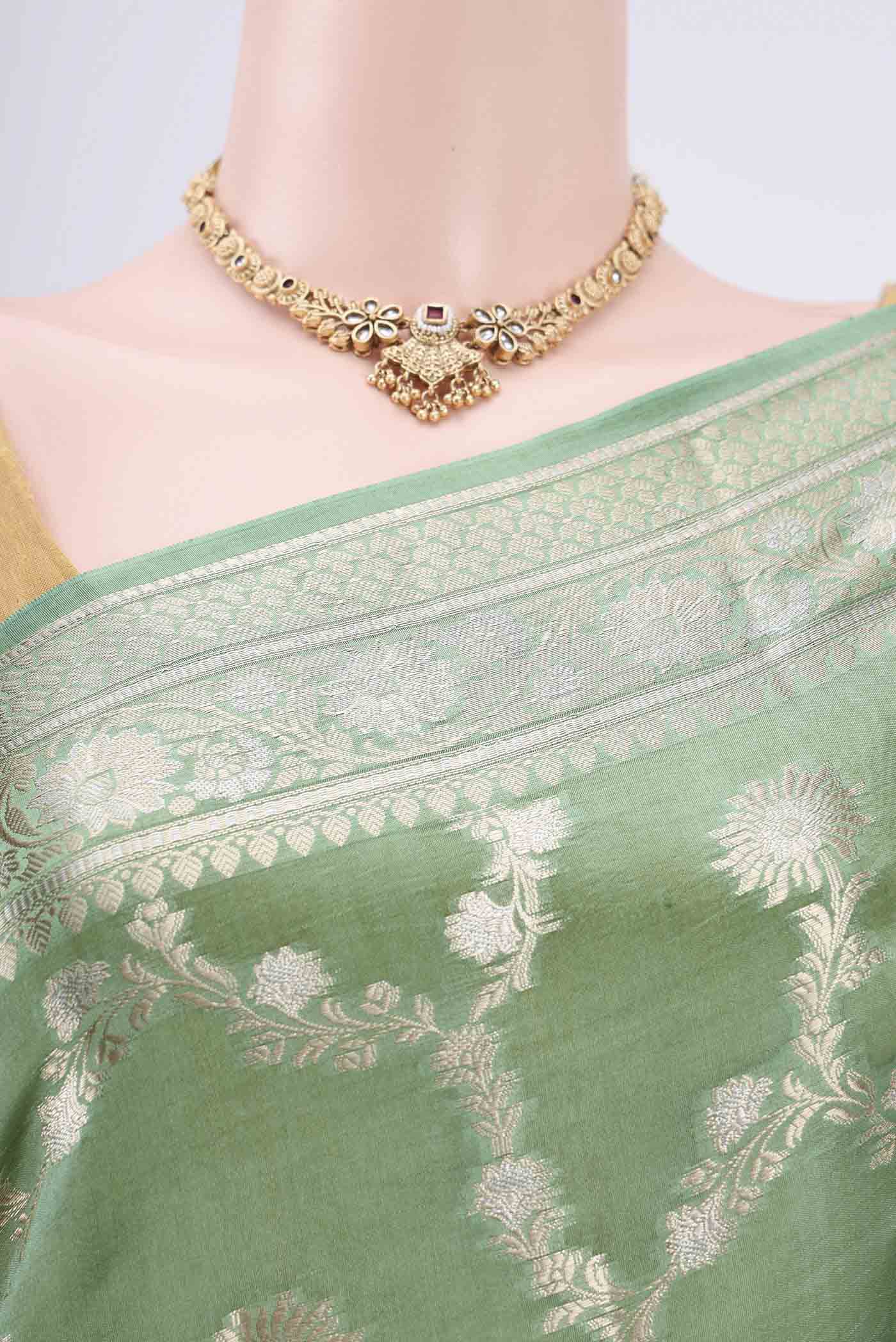 Border image of Light Green Banarasi Raw Silk Saree with Zari Butta on the body and Zari Border. 