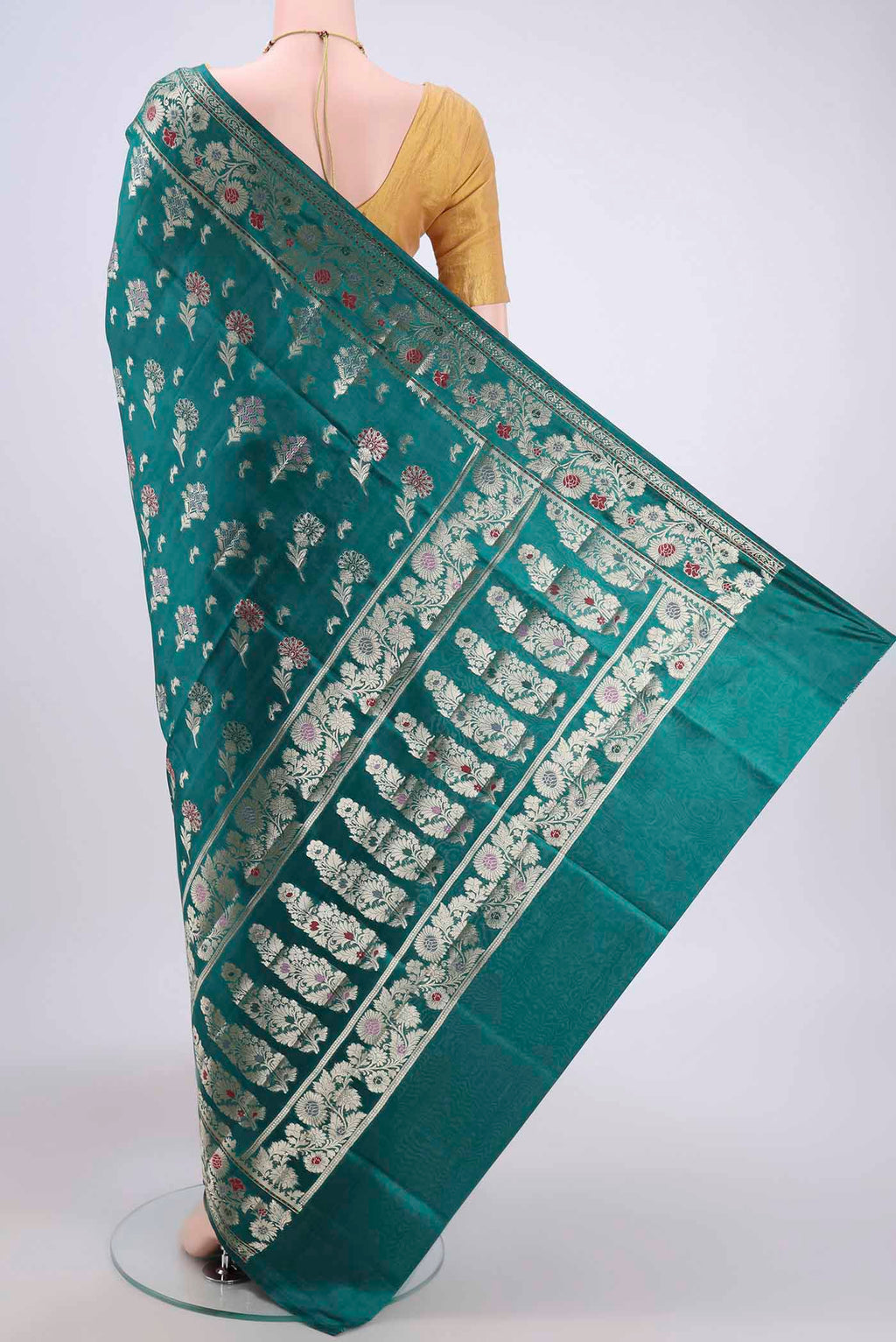 Flat view of Sea Green Banarasi Raw Silk Saree with Zari Butta on the body and Zari Border. 