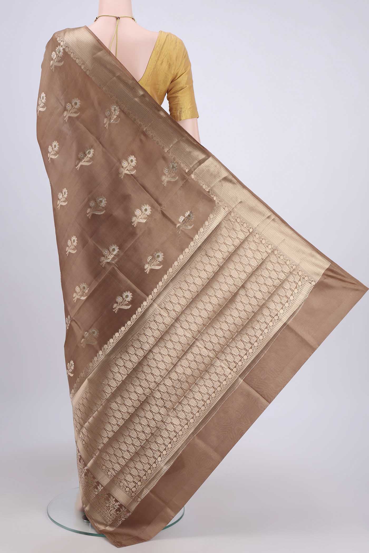 Flat view of Dark Beige Banarasi Raw Silk Saree with Zari Butta on the body and Zari Border. 