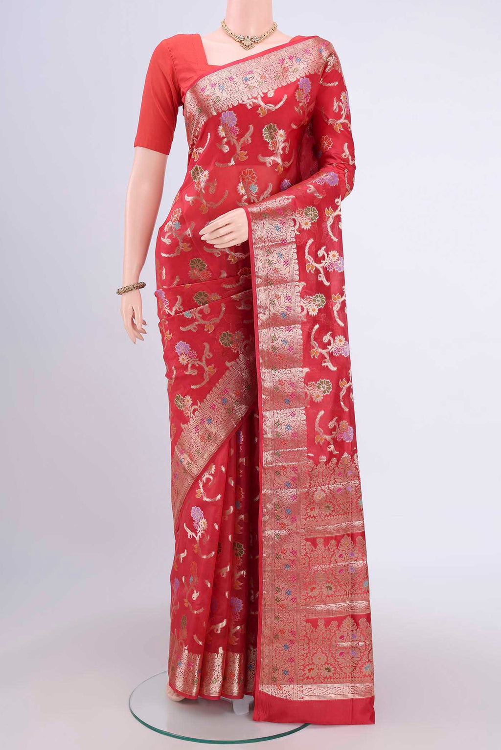 Imperial Red Banarasi Raw Silk Saree with Zari Butta on the body and Zari Border.  displayed on a mannequin