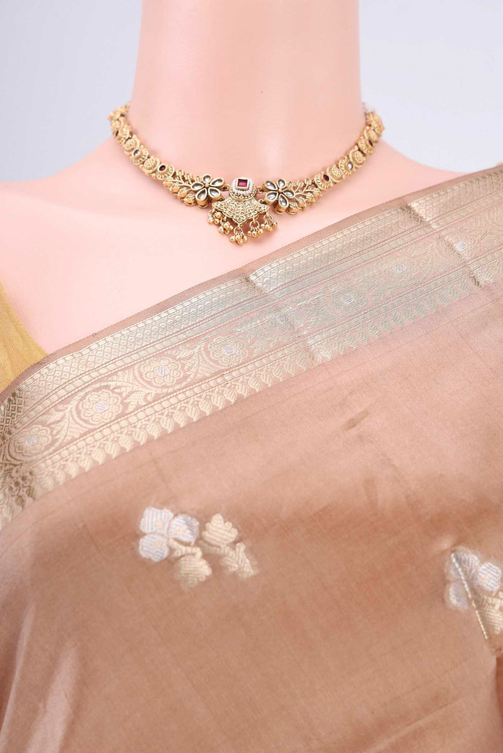 Border image of Beige Banarasi Raw Silk Saree with Zari Butta on the body and Zari Border. 