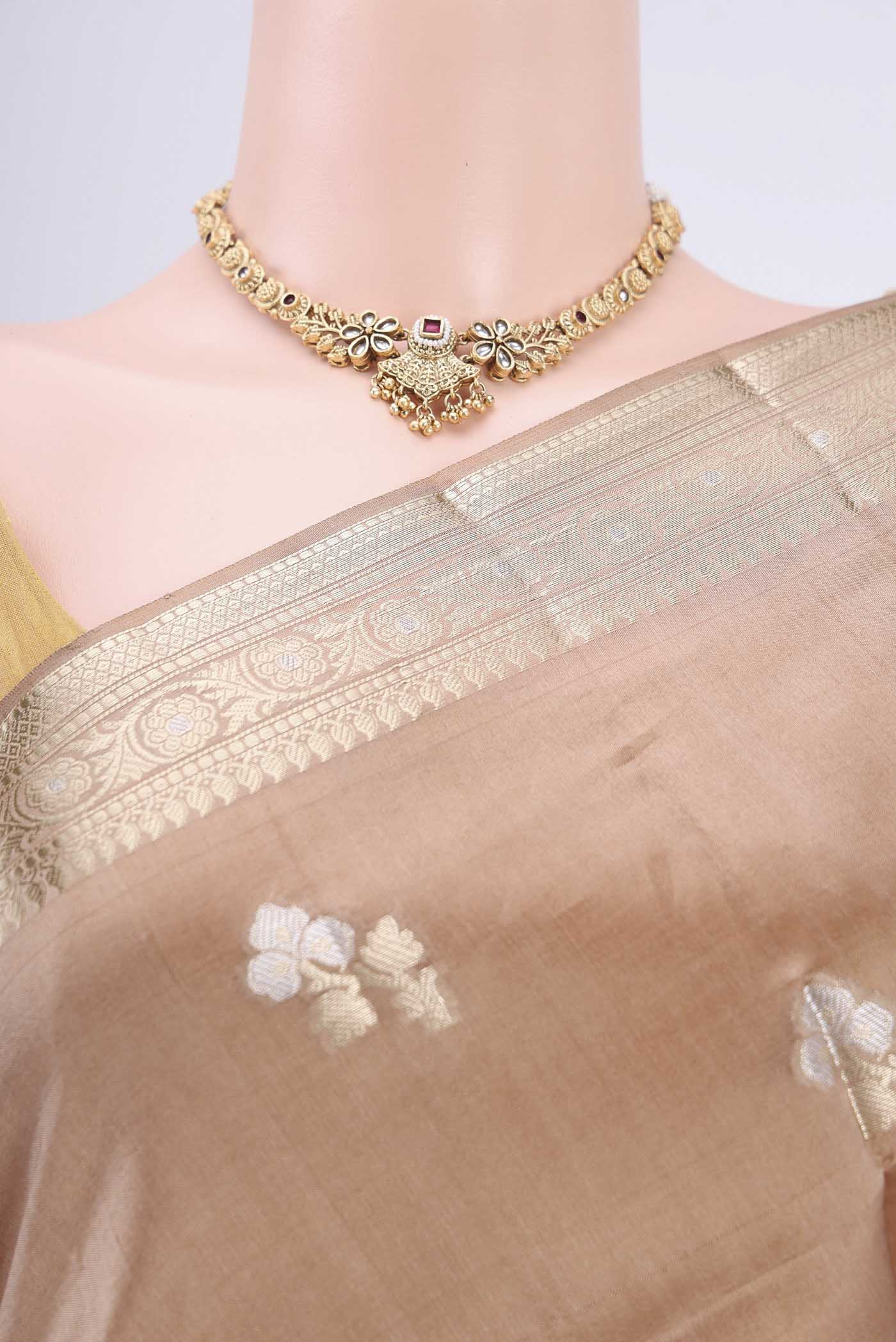 Border image of Beige Banarasi Raw Silk Saree with Zari Butta on the body and Zari Border. 