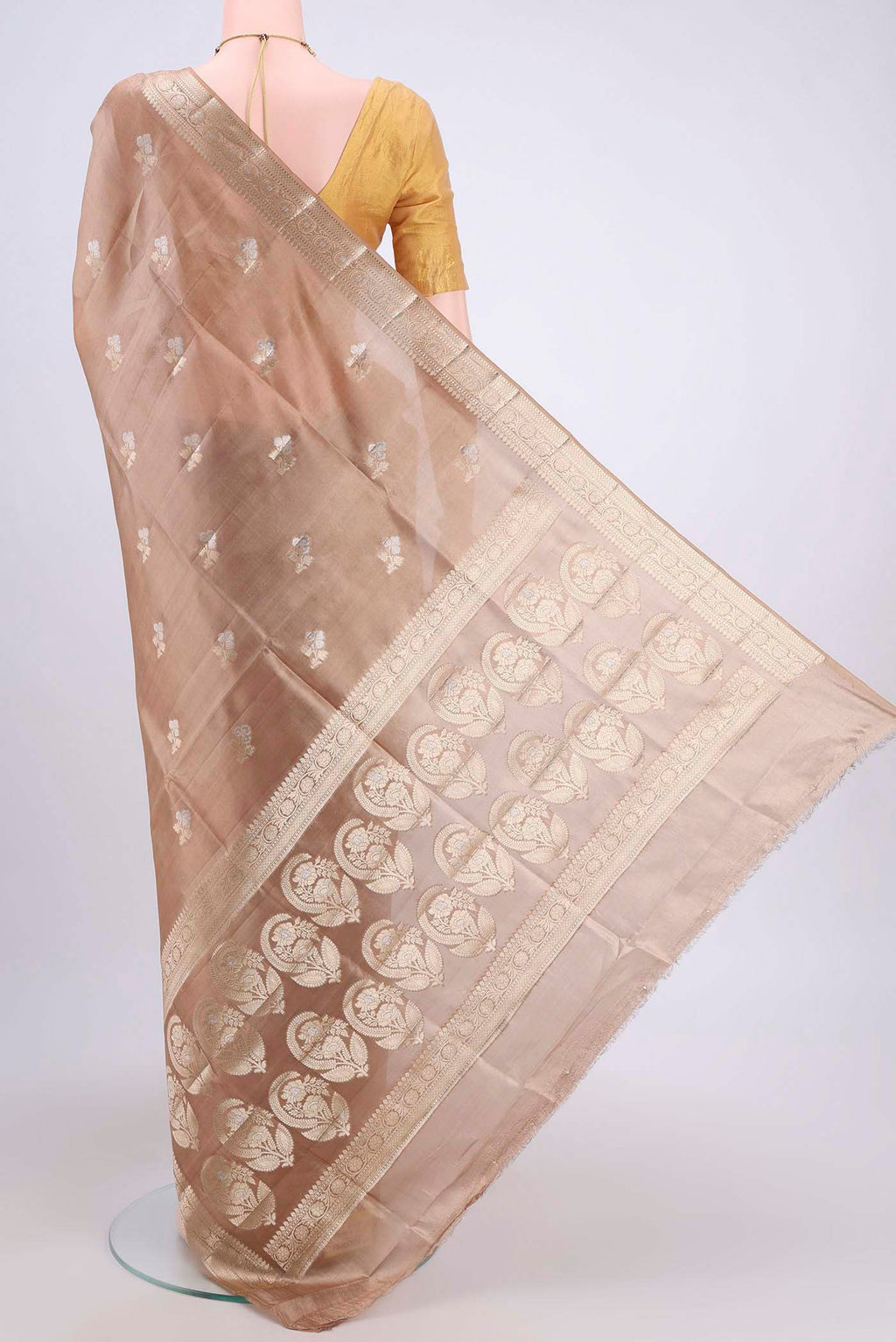 Flat view of Beige Banarasi Raw Silk Saree with Zari Butta on the body and Zari Border. 