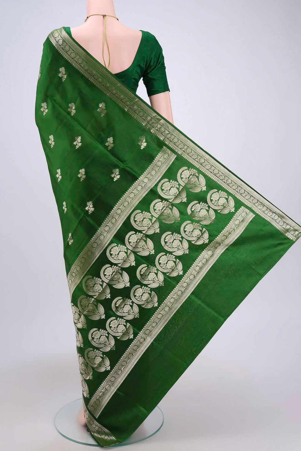 Flat view of Green Banarasi Raw Silk Saree with Zari Butta on the body and Zari Border. 