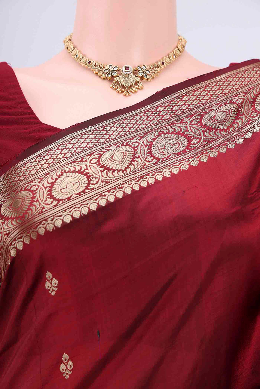 Border image of Maroon Banarasi Katan Silk Saree with Zari Butta on the body and Zari Border. 