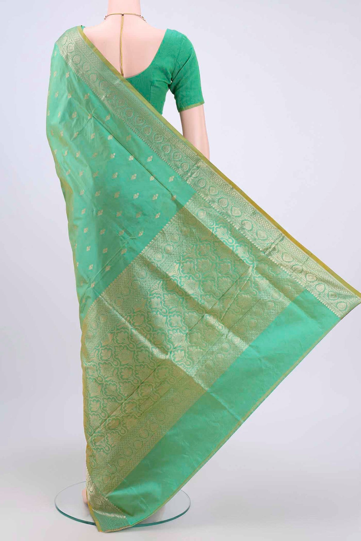 Flat view of Acid Green Dual Tone Banarasi Katan Silk Saree with Zari Butta on the body and Zari Border. 