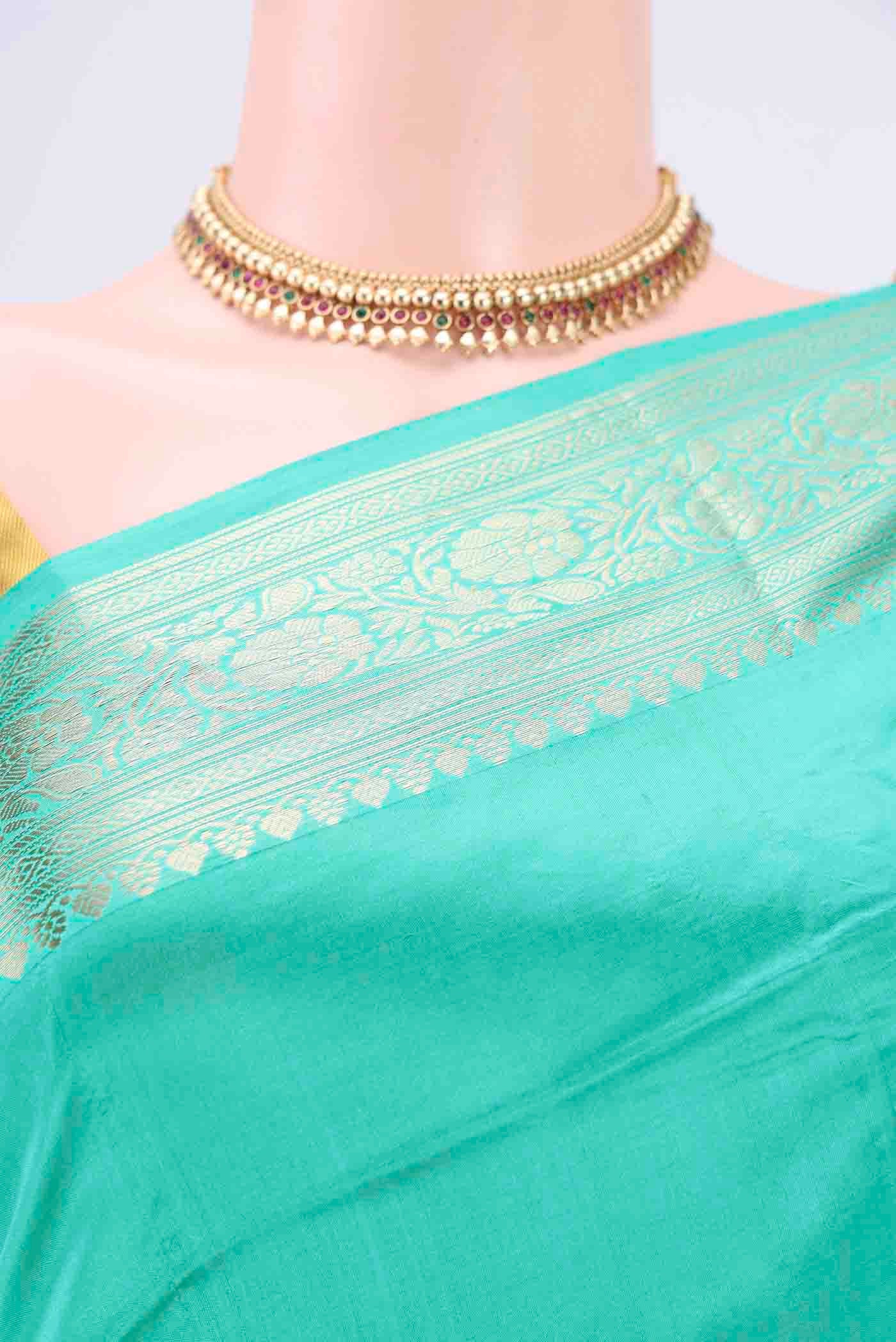 Border image of Turquoise Dual Tone Banarasi Katan Silk Saree with Thread Butta on the body and Thread Border. 