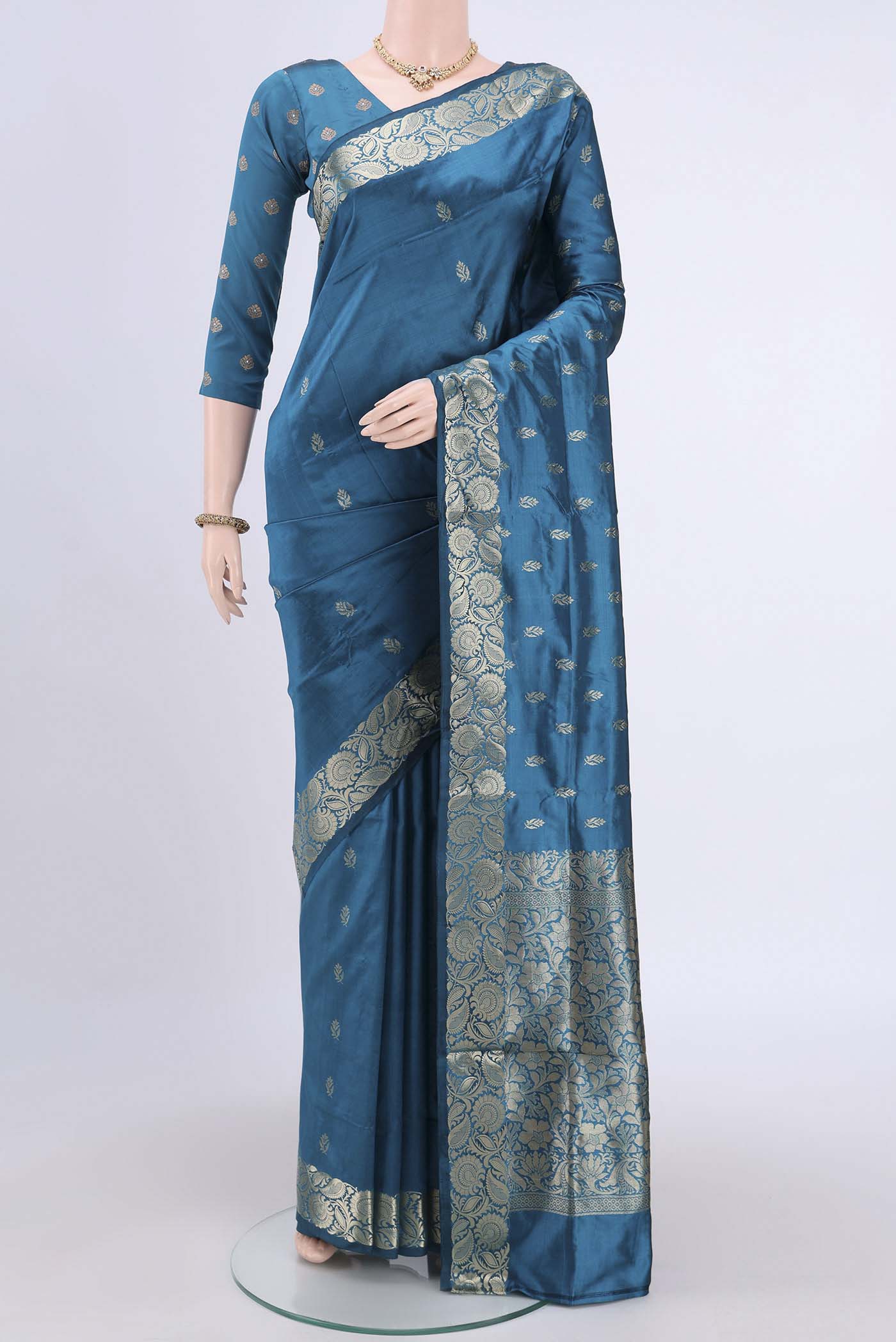Dark Blue Dual Tone Banarasi Katan Silk Saree with Zari Butta on the body and Zari Border.  displayed on a mannequin