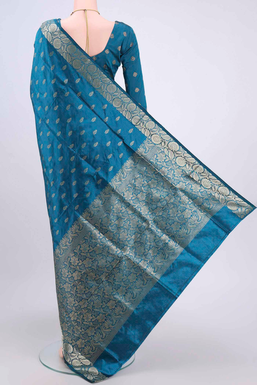 Flat view of Dark Blue Dual Tone Banarasi Katan Silk Saree with Zari Butta on the body and Zari Border. 