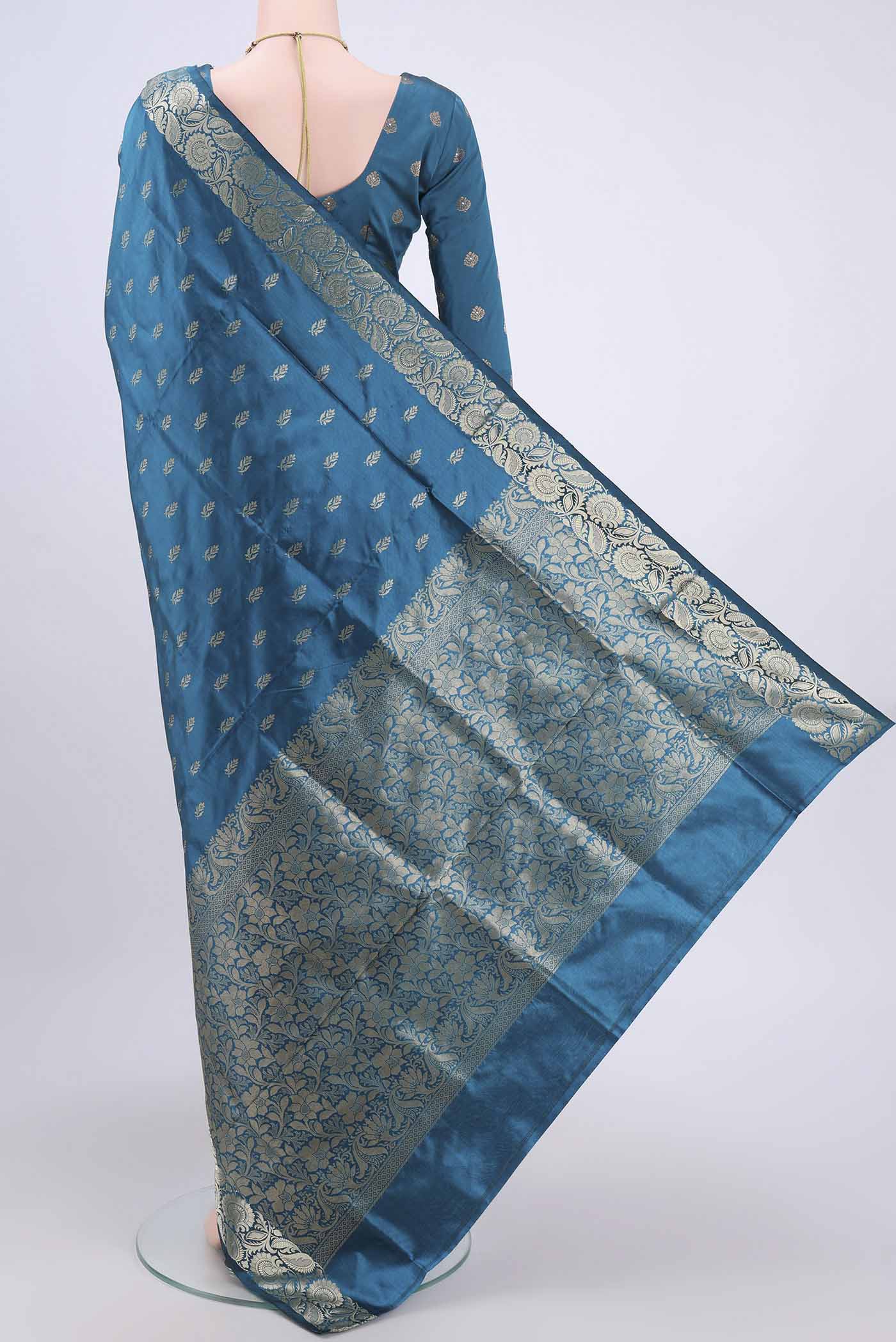 Flat view of Dark Blue Dual Tone Banarasi Katan Silk Saree with Zari Butta on the body and Zari Border. 