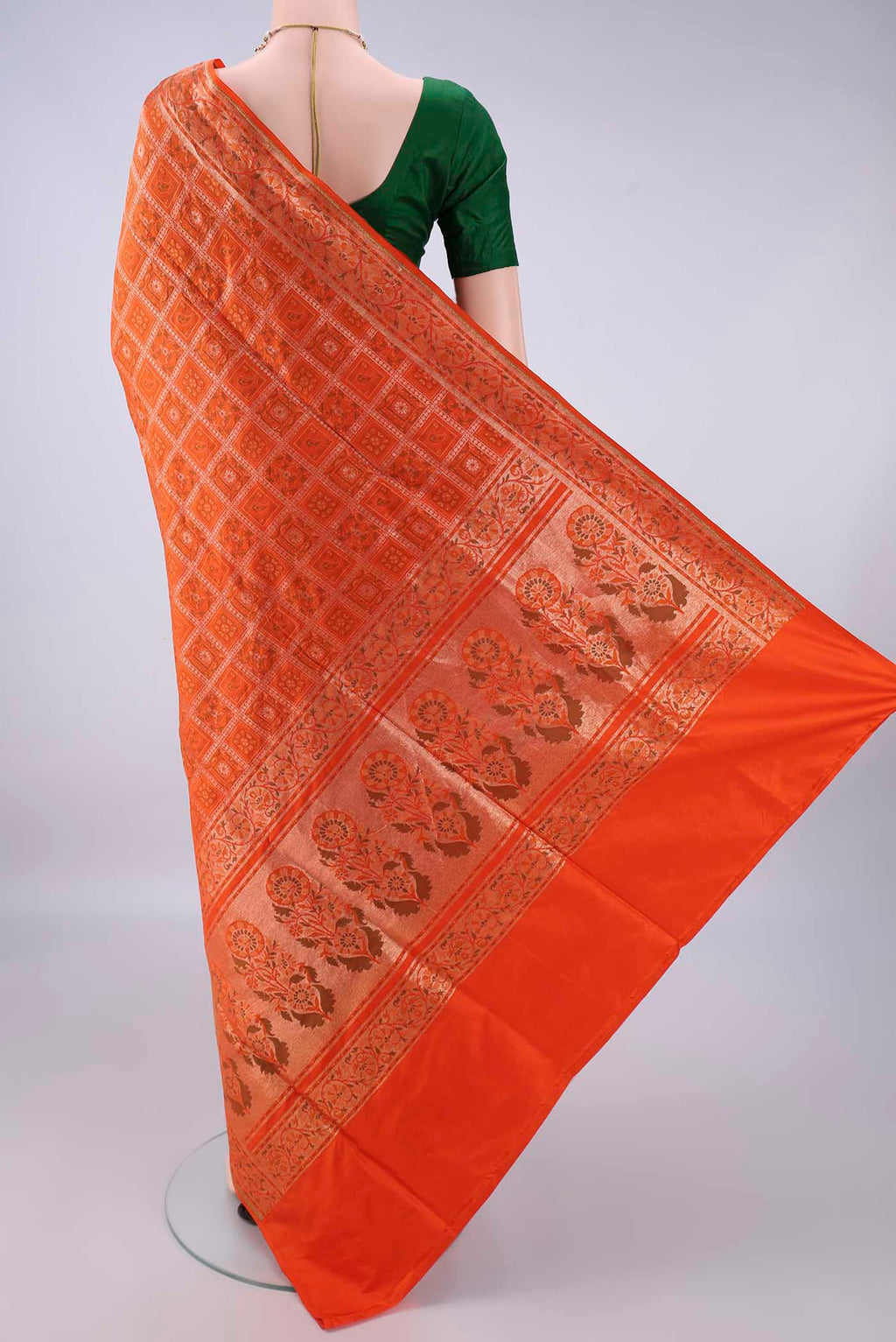 Flat view of Pure Silk Orange Banarasi Jamavar Saree with Checked design on the body and Zari Border. 