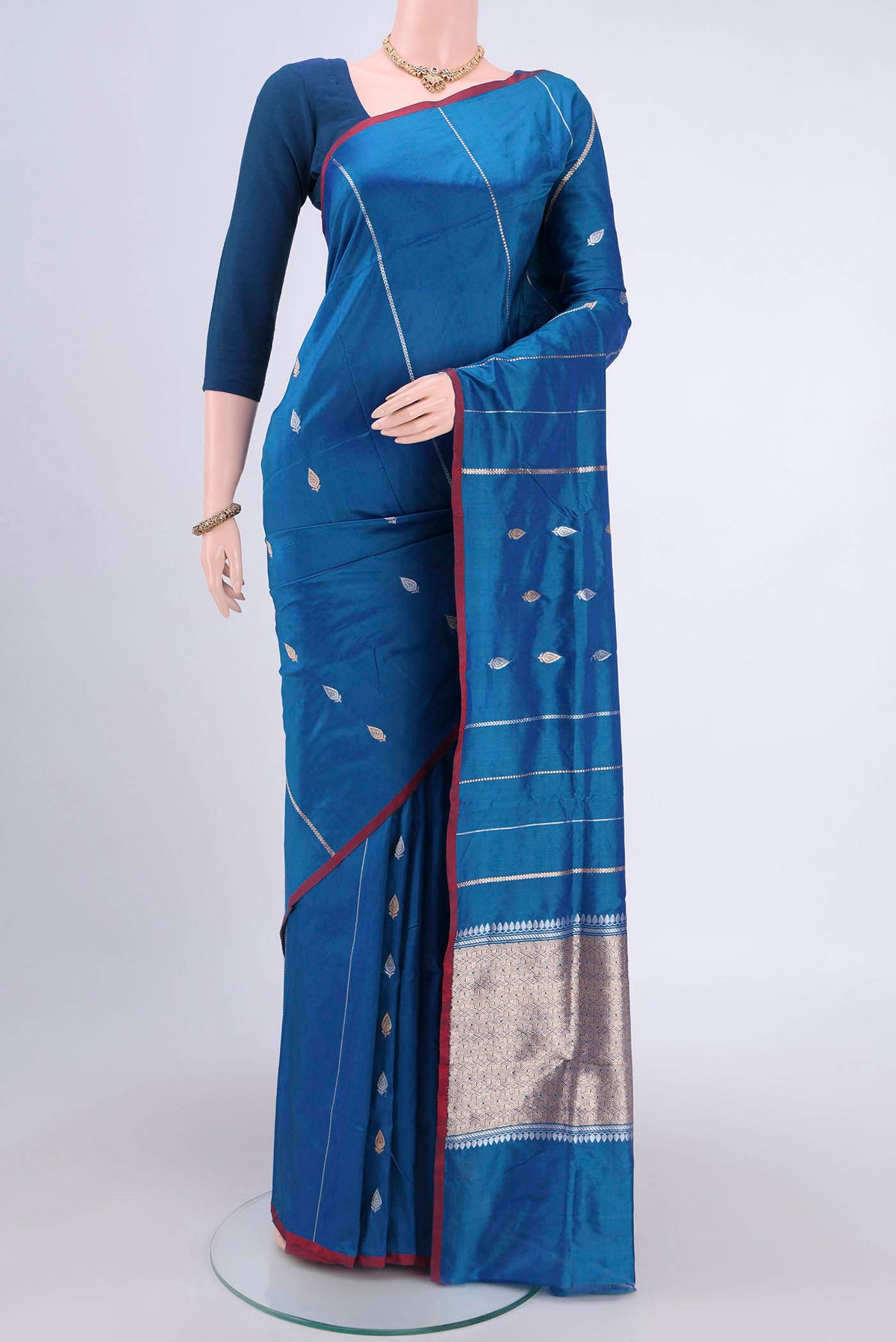 Blue Dual Tone Banarasi Katan Silk Saree with Zari Butta on the body and Zari Border.  displayed on a mannequin