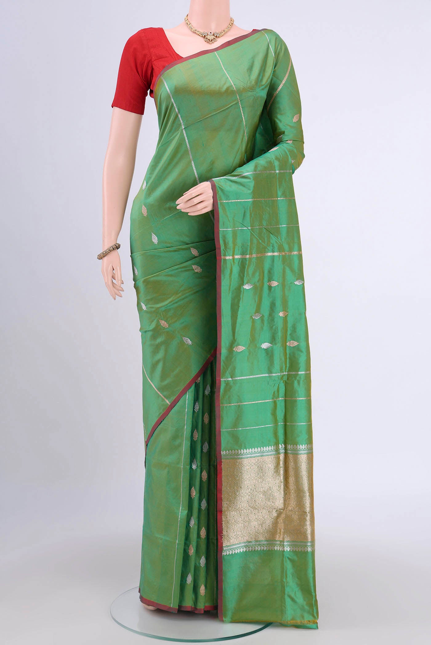 Acid Green Dual Tone Banarasi Katan Silk Saree with Zari Butta on the body and Zari Border.  displayed on a mannequin