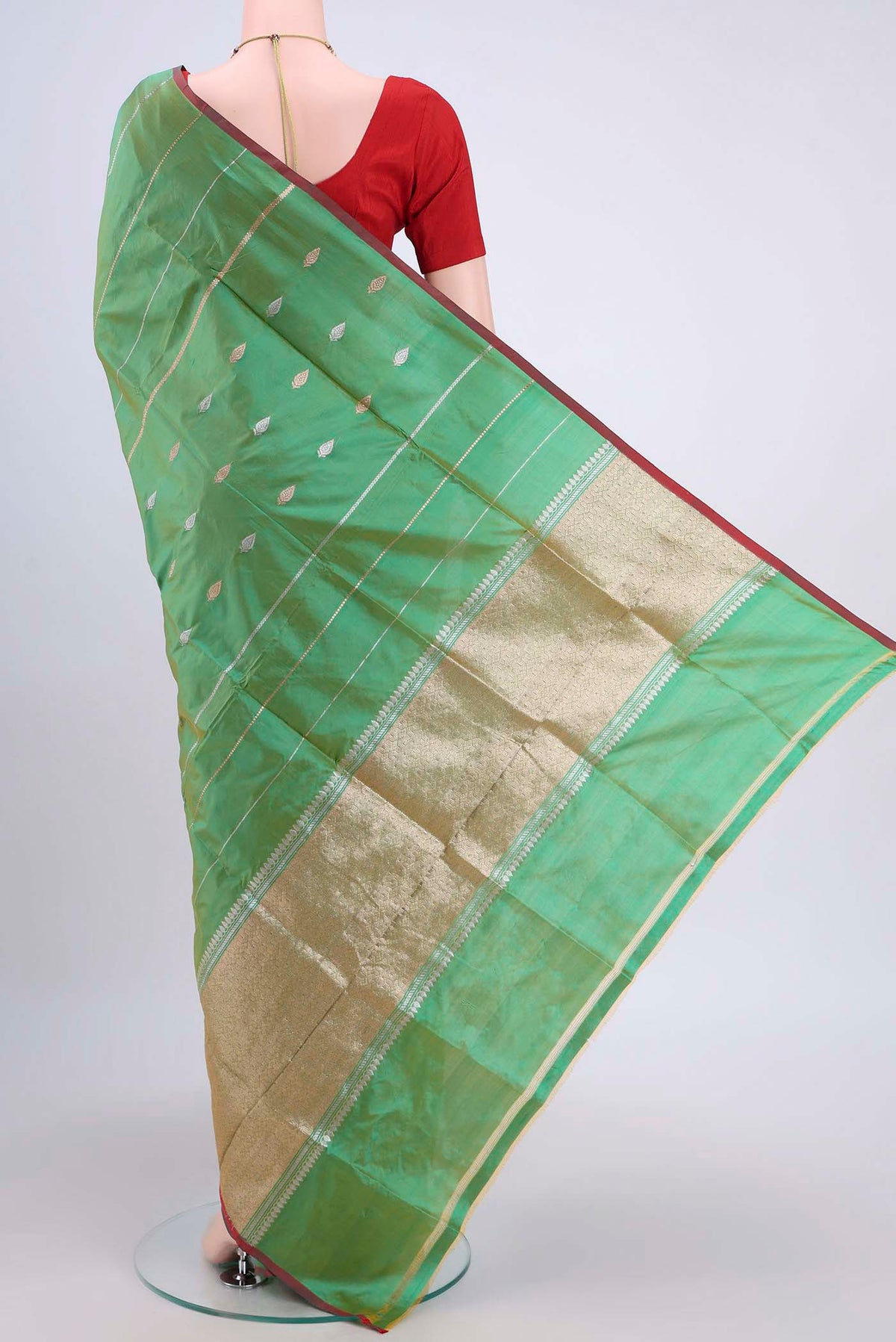 Flat view of Acid Green Dual Tone Banarasi Katan Silk Saree with Zari Butta on the body and Zari Border. 