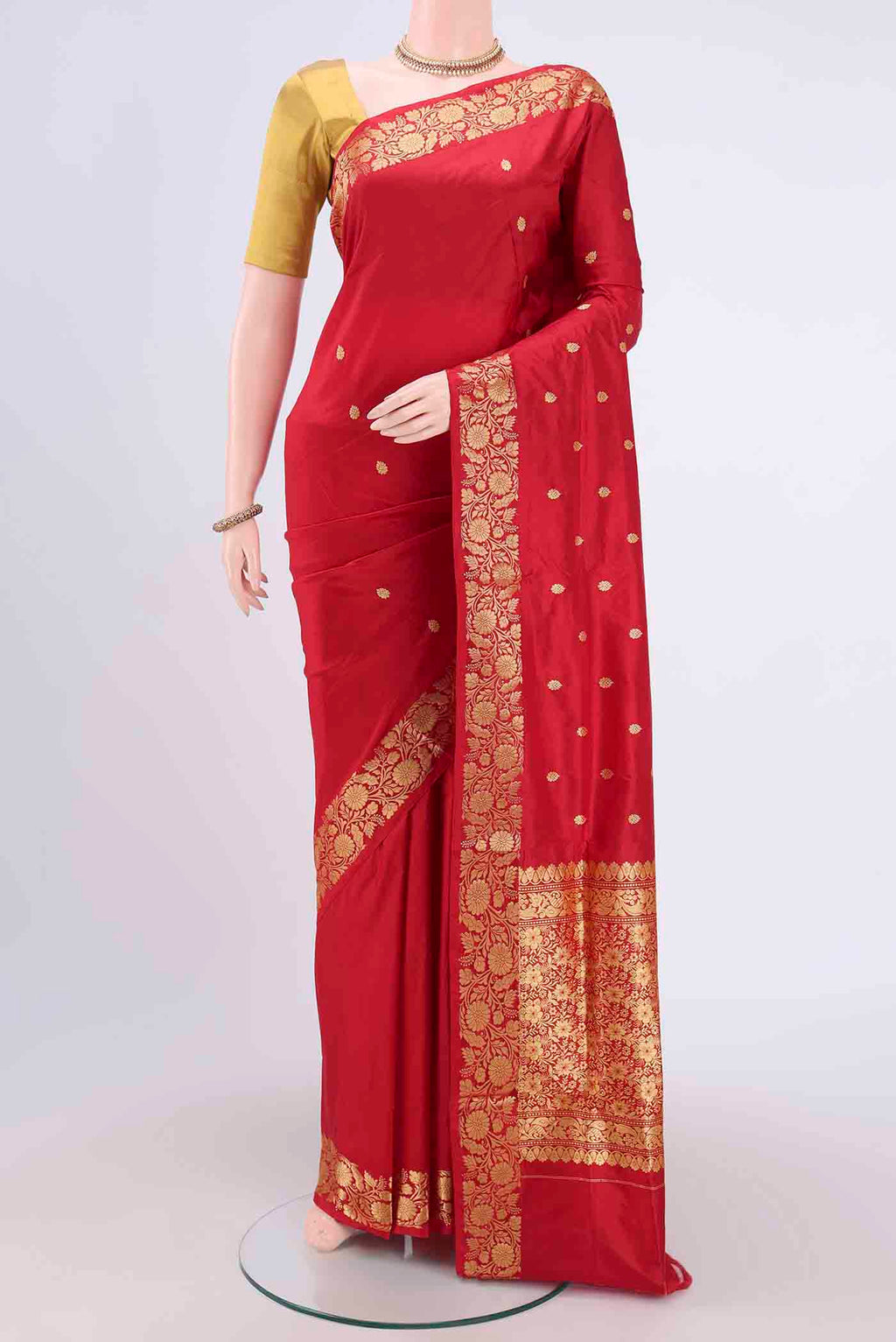 Maroon Dual Tone Banarasi Katan Silk Saree with Zari Butta on the body and Zari Border.  displayed on a mannequin