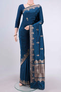Blue Banarasi Katan Silk Saree with Zari Butta on the body and Zari Border.  displayed on a mannequin