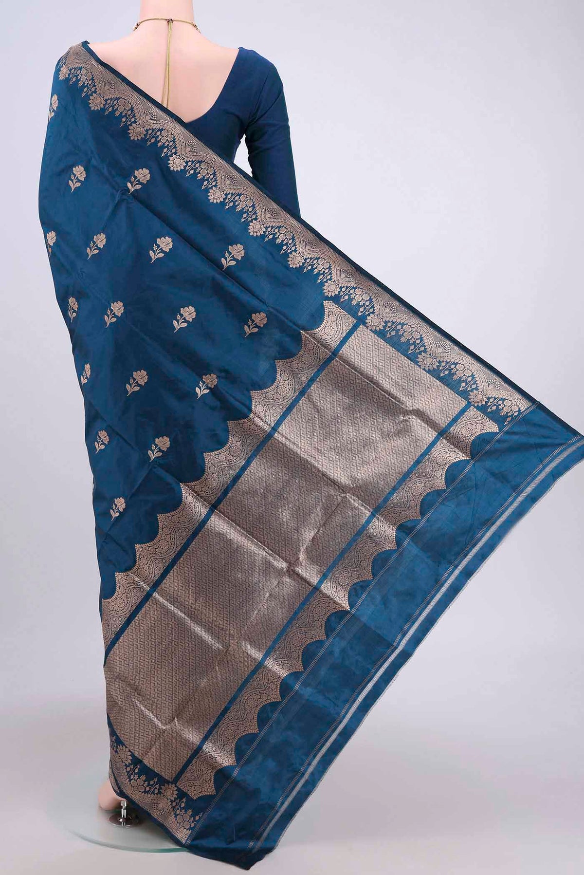 Flat view of Blue Banarasi Katan Silk Saree with Zari Butta on the body and Zari Border. 