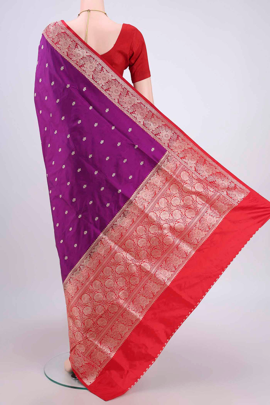 Flat view of Magenta Banarasi Katan Silk Saree with Zari Butta on the body and Zari Border. 